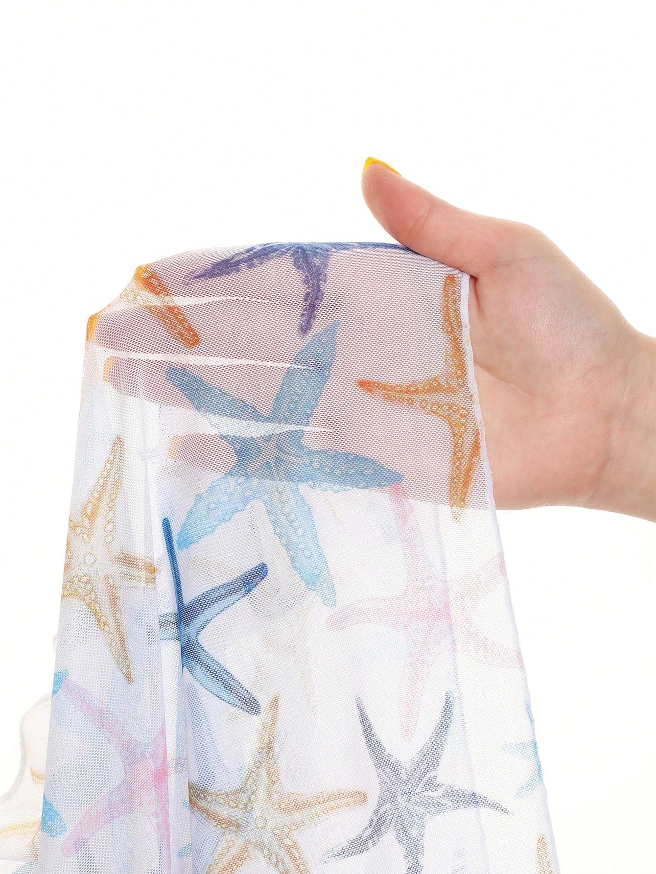 Blue tween girls swimsuit cover up with geometric starfish print, ruffle trim, round neck, short sleeves, and semi-sheer knit fabric for beach or pool wear.