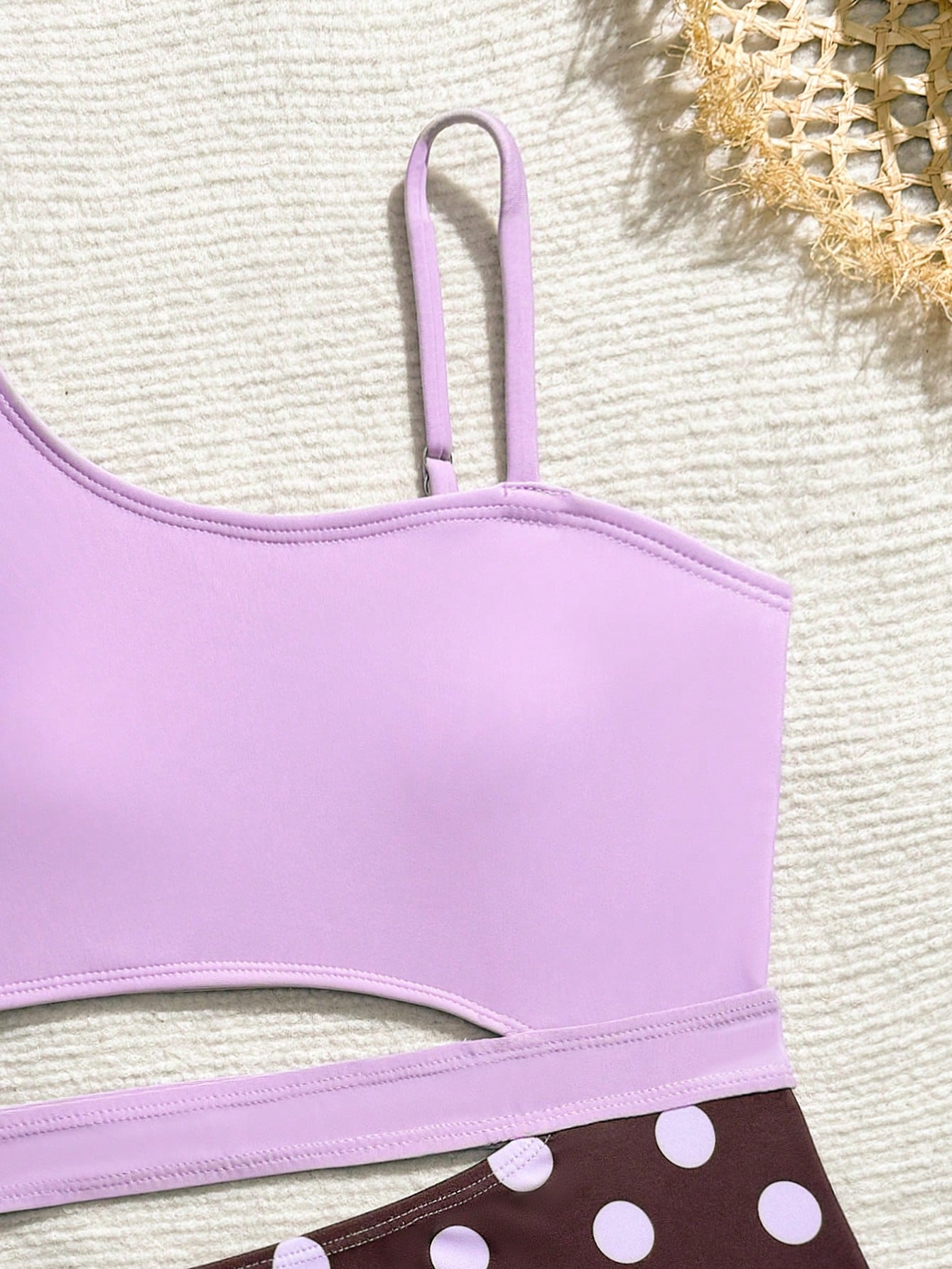 Purple tween girls one-piece swimsuit with asymmetrical neckline, cut-out waist, striped pattern, fitted silhouette, and lined body.