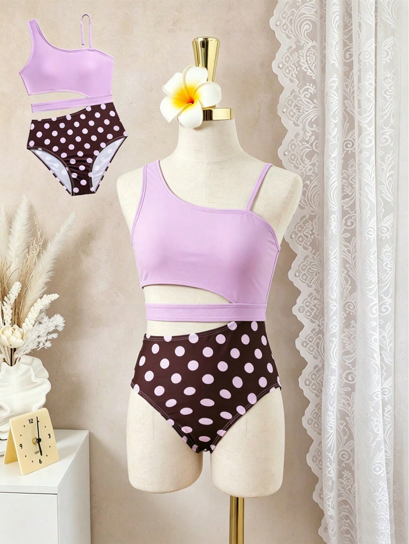 Purple tween girls one-piece swimsuit with asymmetrical neckline, cut-out waist, striped pattern, fitted silhouette, and lined body.