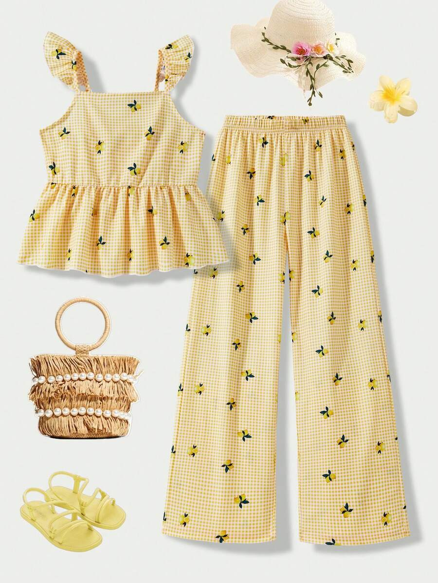 Tween girl wearing an apricot 2-piece outfit set featuring a shirred spaghetti strap short cami top and matching wide-leg long pants.