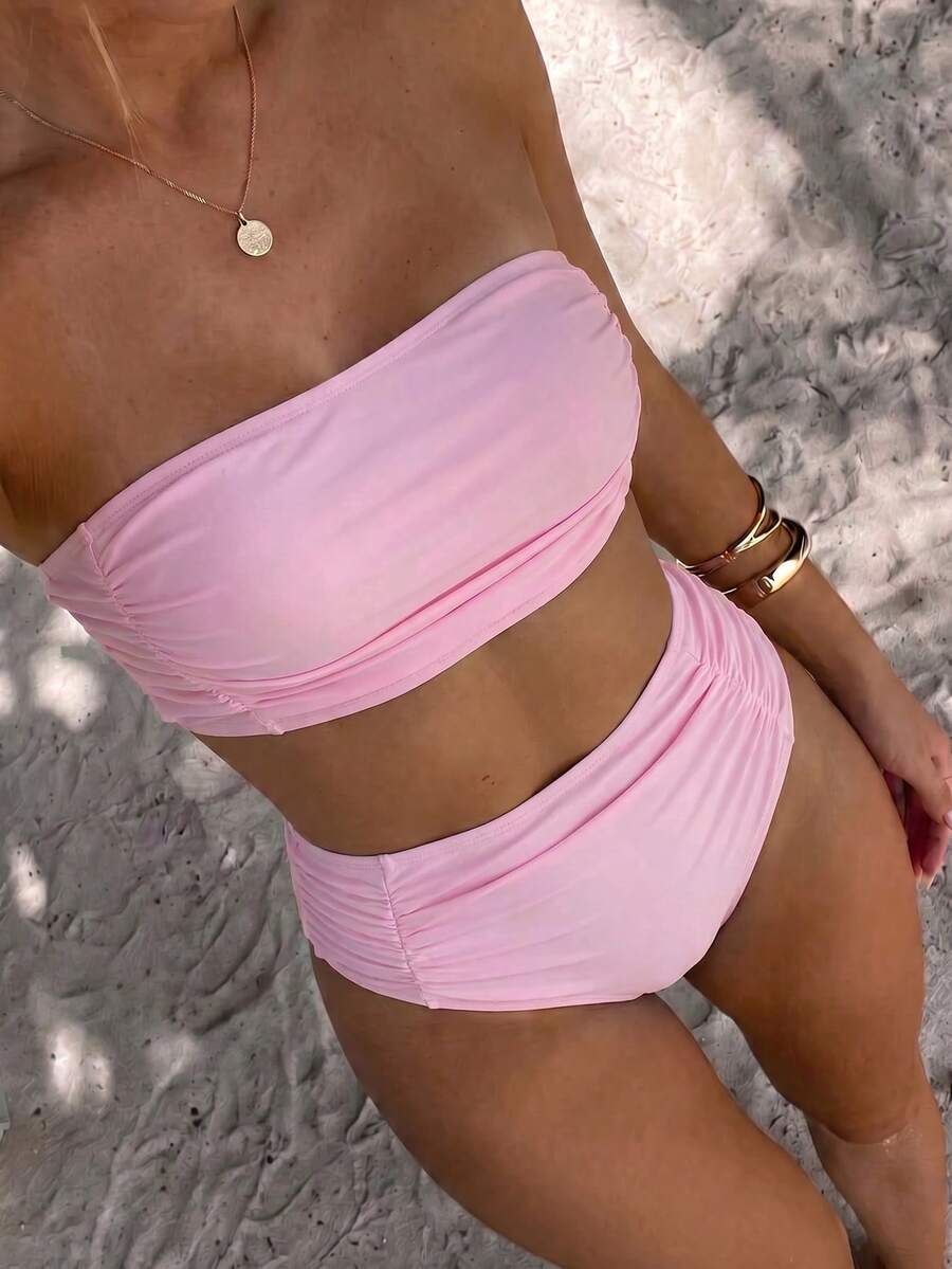 Women's black strapless ruched bandeau bikini top with high waisted bottoms