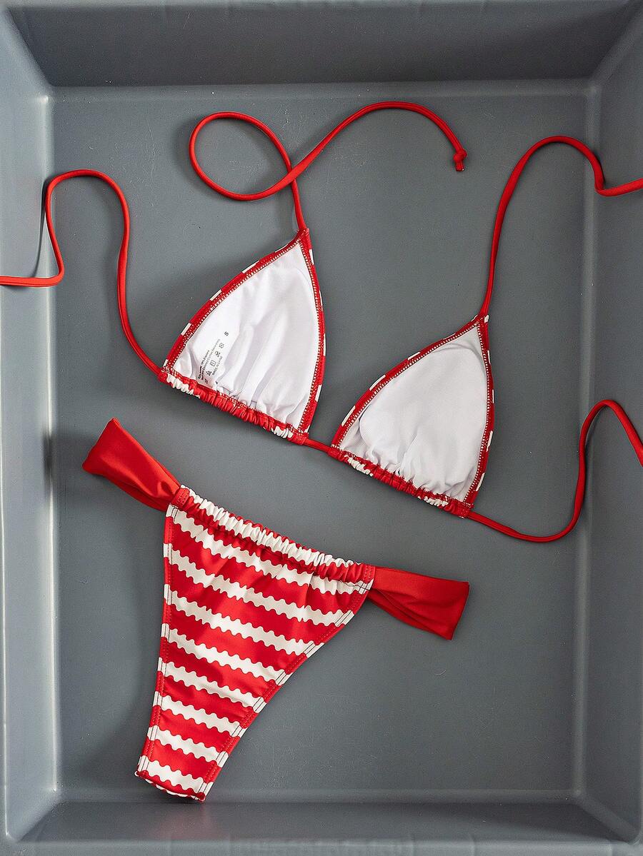 Women's striped halter two-piece swimsuit featuring a lace-up triangle top with removable padding and high-cut low-waist bikini bottoms.