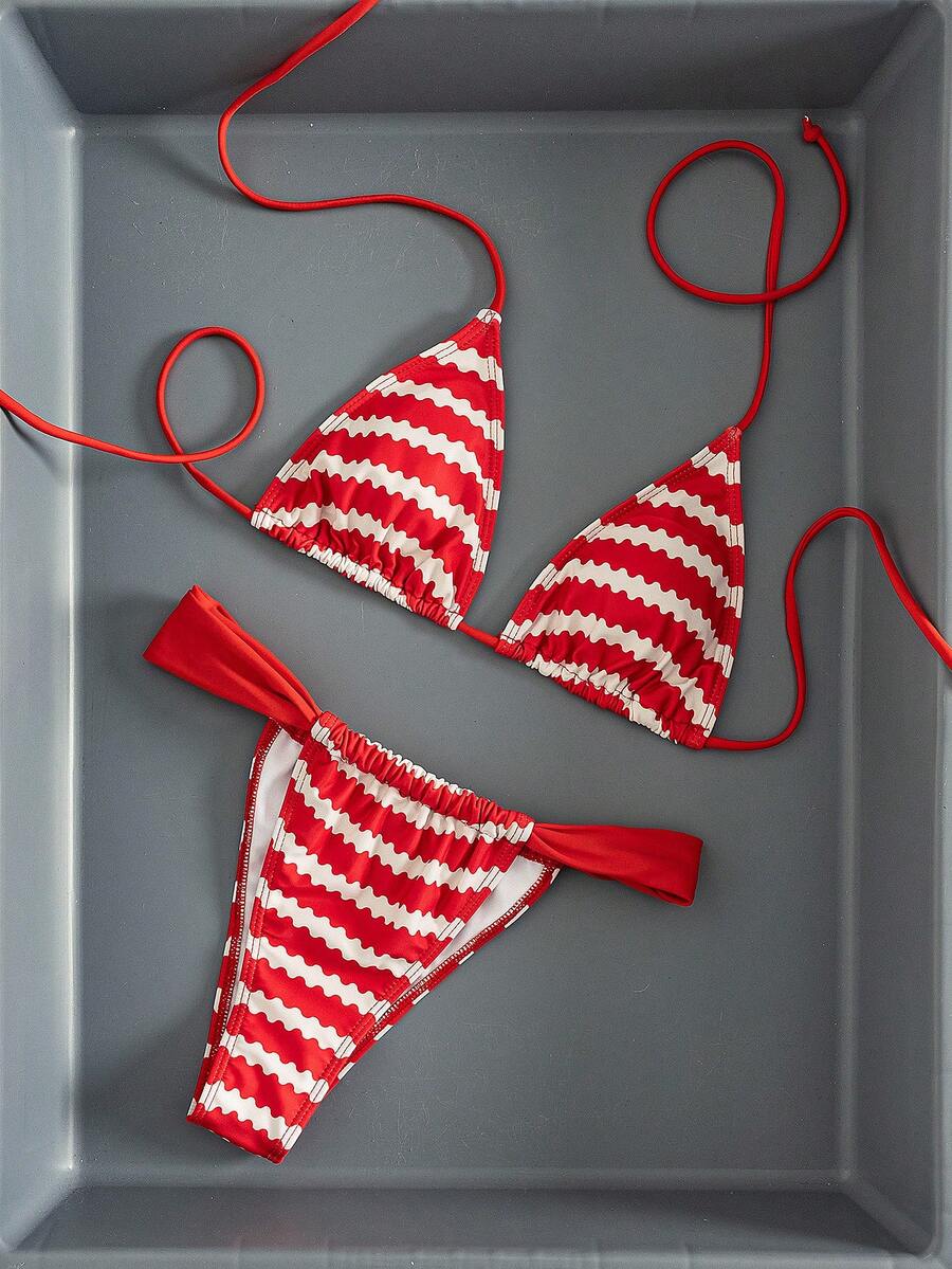 Women's striped halter two-piece swimsuit featuring a lace-up triangle top with removable padding and high-cut low-waist bikini bottoms.