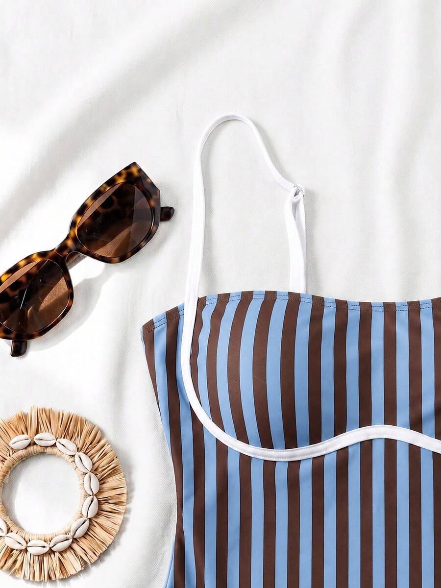 Black colorblock women's one-piece swimsuit with spaghetti straps and high stretch fabric.