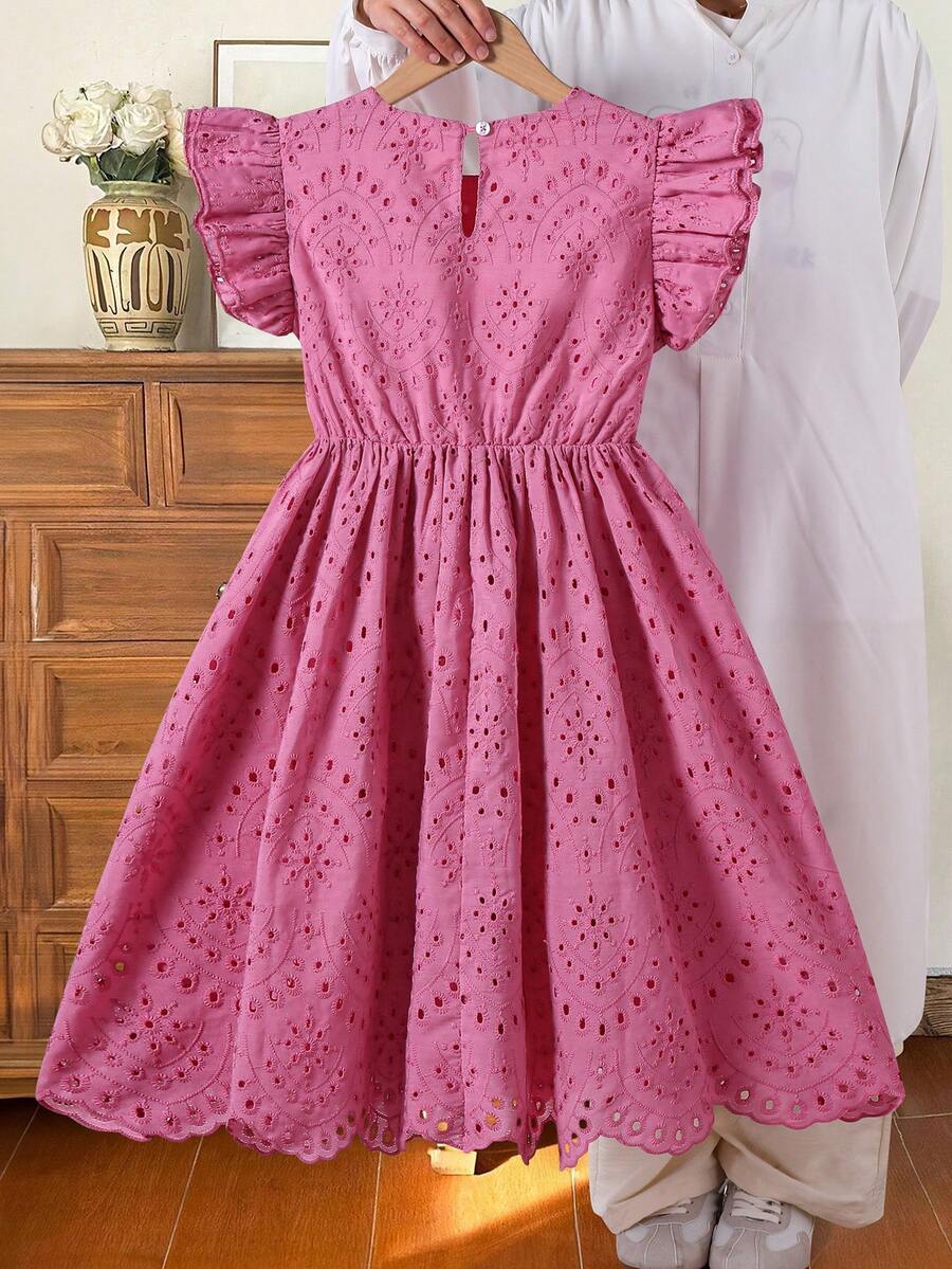 Tween girls blue short smock dress featuring flounce short sleeves, high waist flared hem, round neck, and front bow detail.