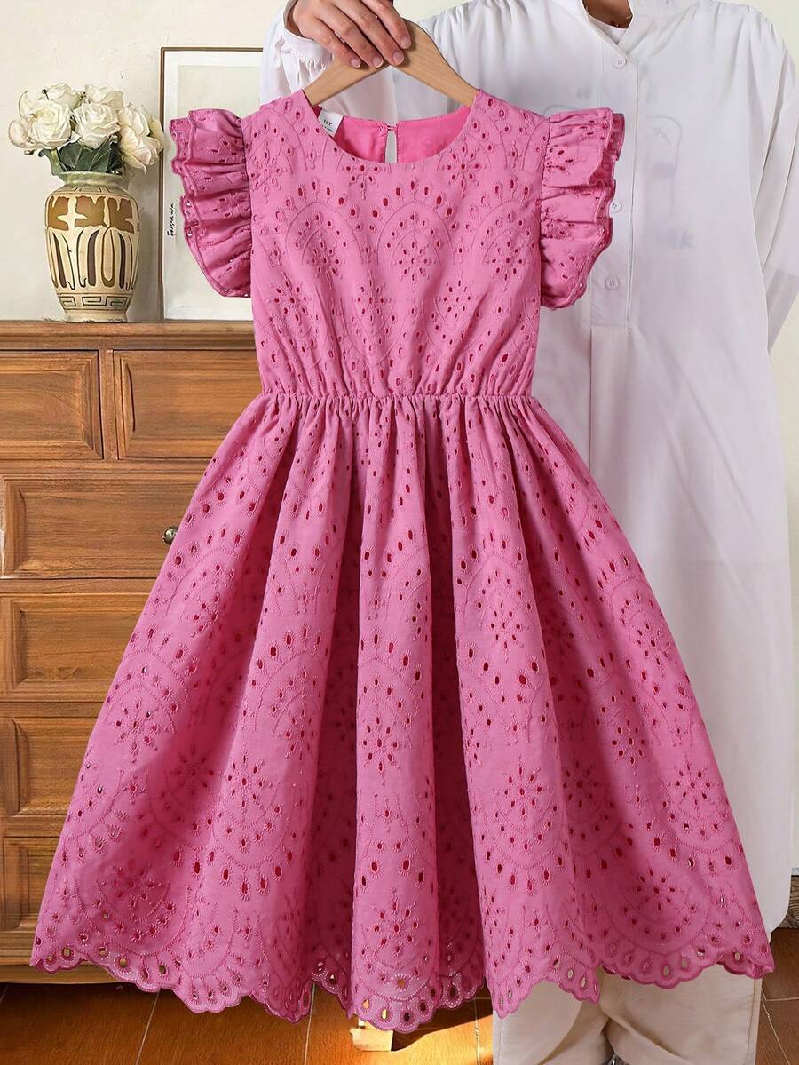 Tween girls blue short smock dress featuring flounce short sleeves, high waist flared hem, round neck, and front bow detail.