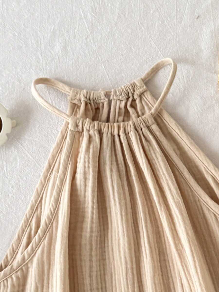 Tween girls floral halter A-line dress with contrast lace, applique and fringe details, sleeveless short length in polyester