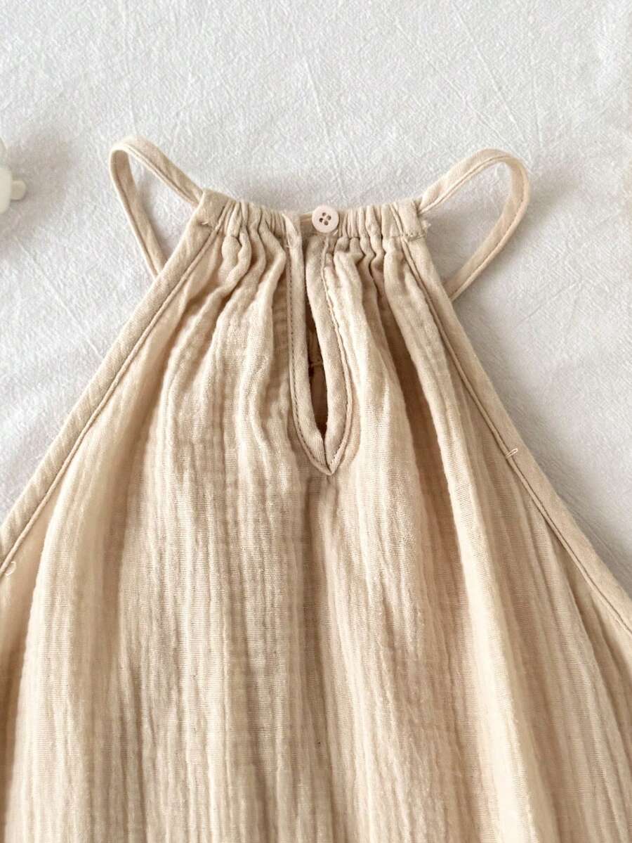 Tween girls floral halter A-line dress with contrast lace, applique and fringe details, sleeveless short length in polyester