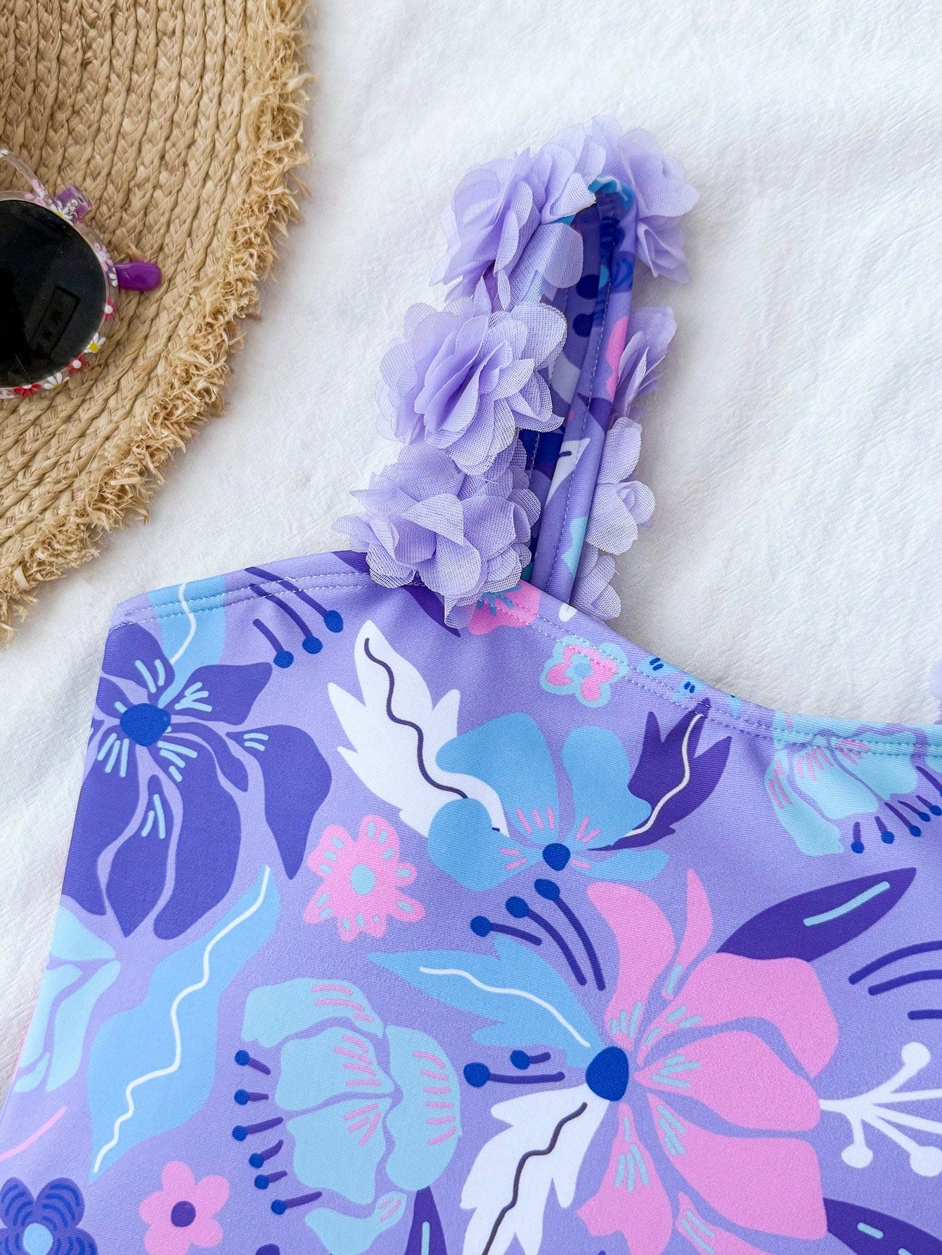 NEWSHEIN tween girls one-piece swimsuit in blue with geometric full print, twist shoulder straps, lined body, and vacation swimwear style.