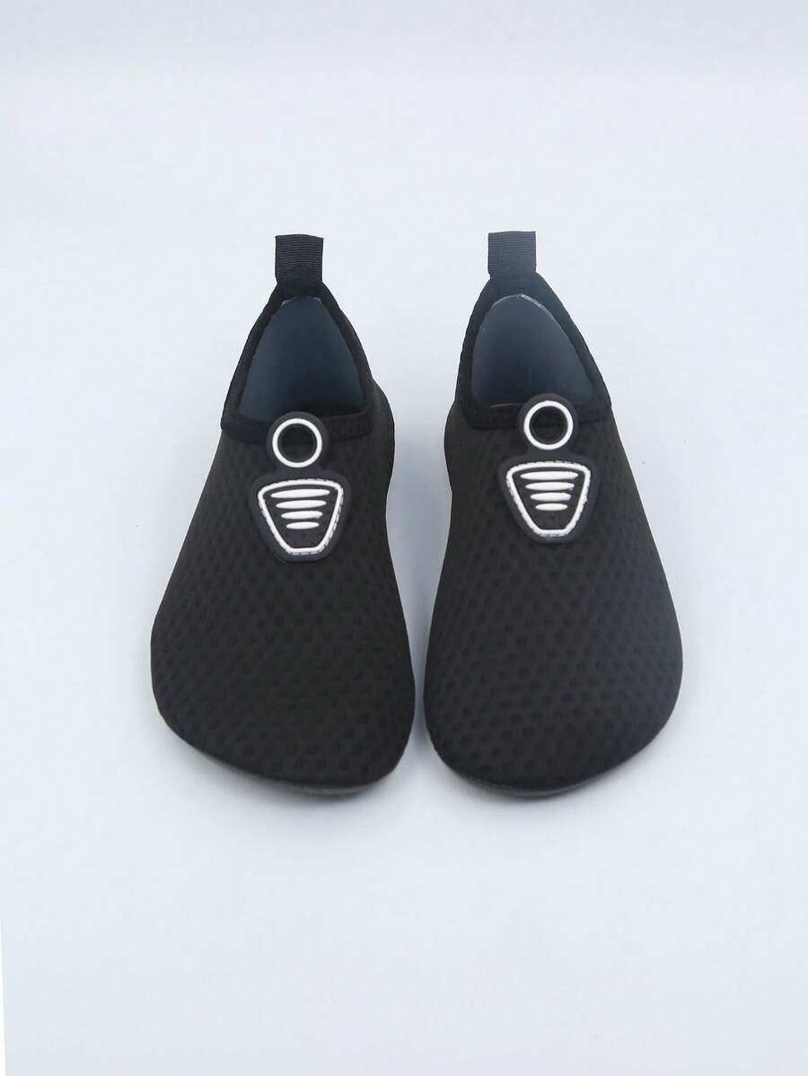 Kids black graphic water shoes with breathable Lycra upper, slip-on stretch design, and non-slip rubber outsole for boys and girls.