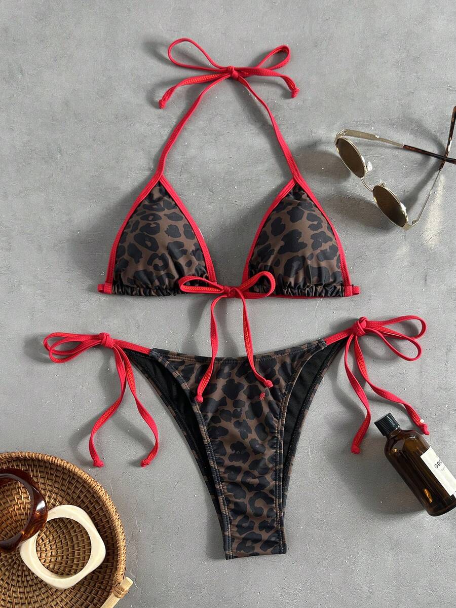 Women's tropical print two-piece halter bikini set featuring wireless triangle cups with tie-back detail and high-waist bikini bottoms.