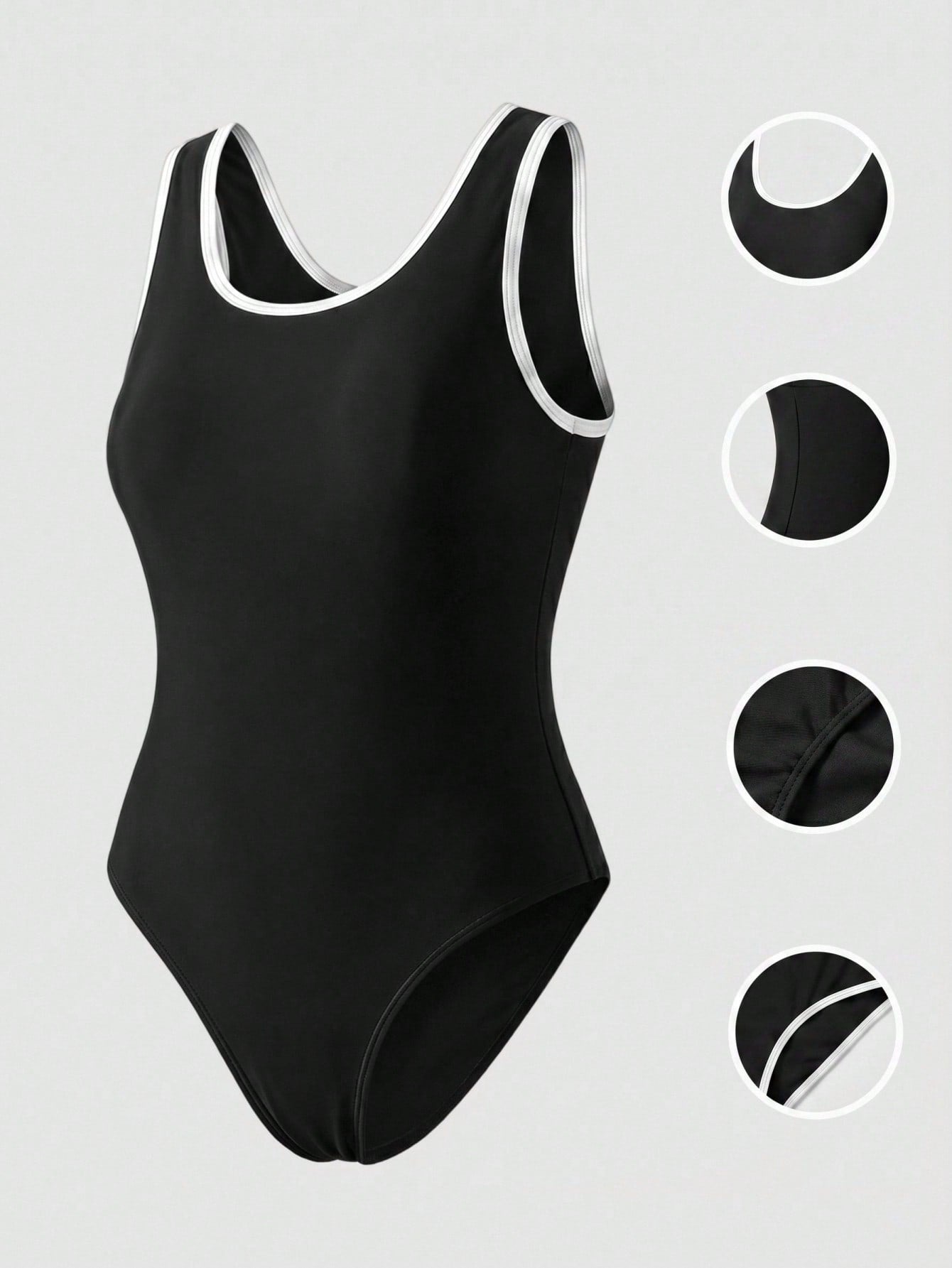 Tween girls' black and white one-piece swimsuit with striped patchwork design, scoop neck, asymmetrical cut-out detail, and fitted vacation swimwear style.