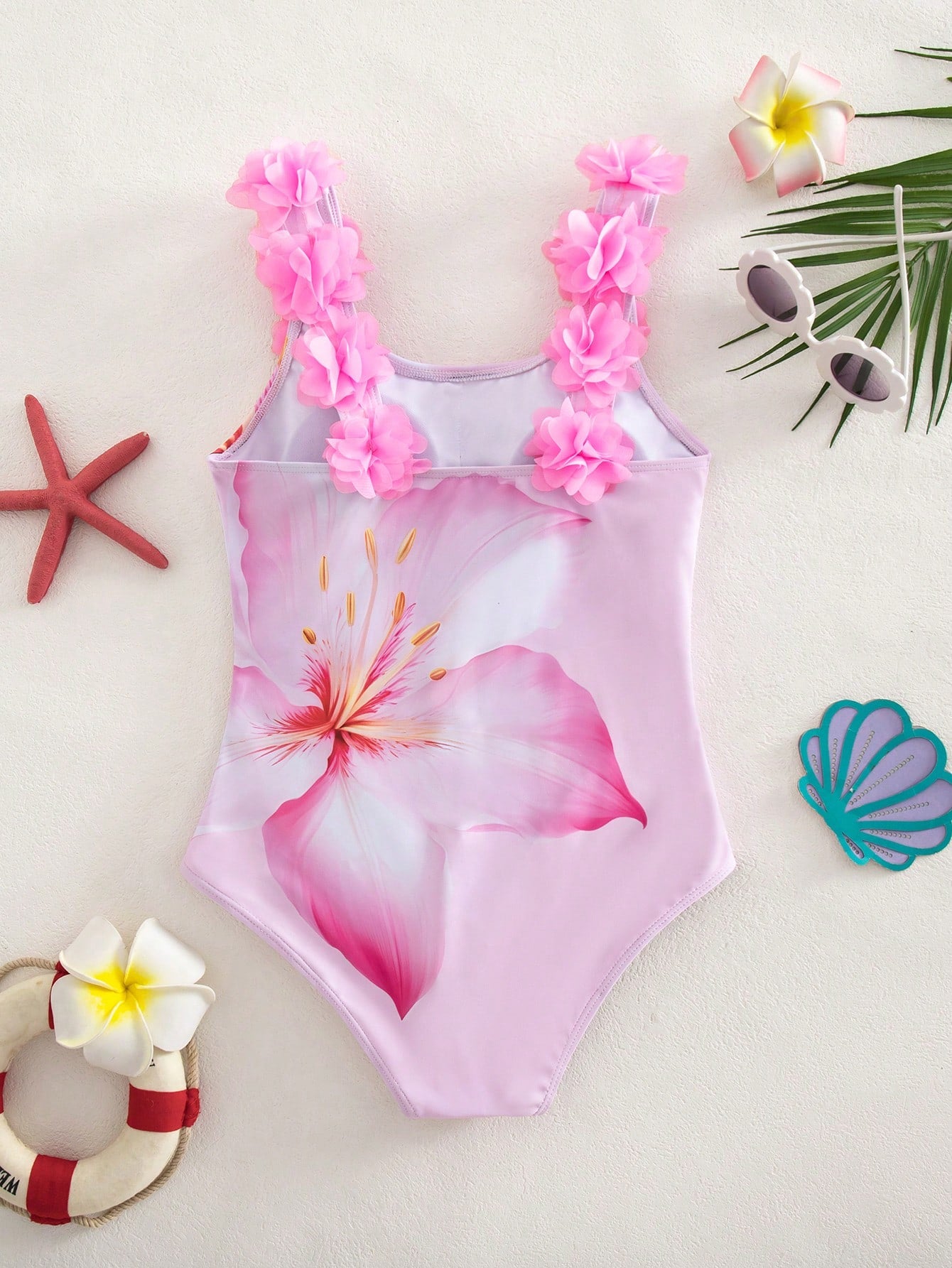 Tween girls one-piece swimsuit with 3D floral applique details, plant graphics, scoop neck, fitted shape, and lined body for beach and vacation wear.