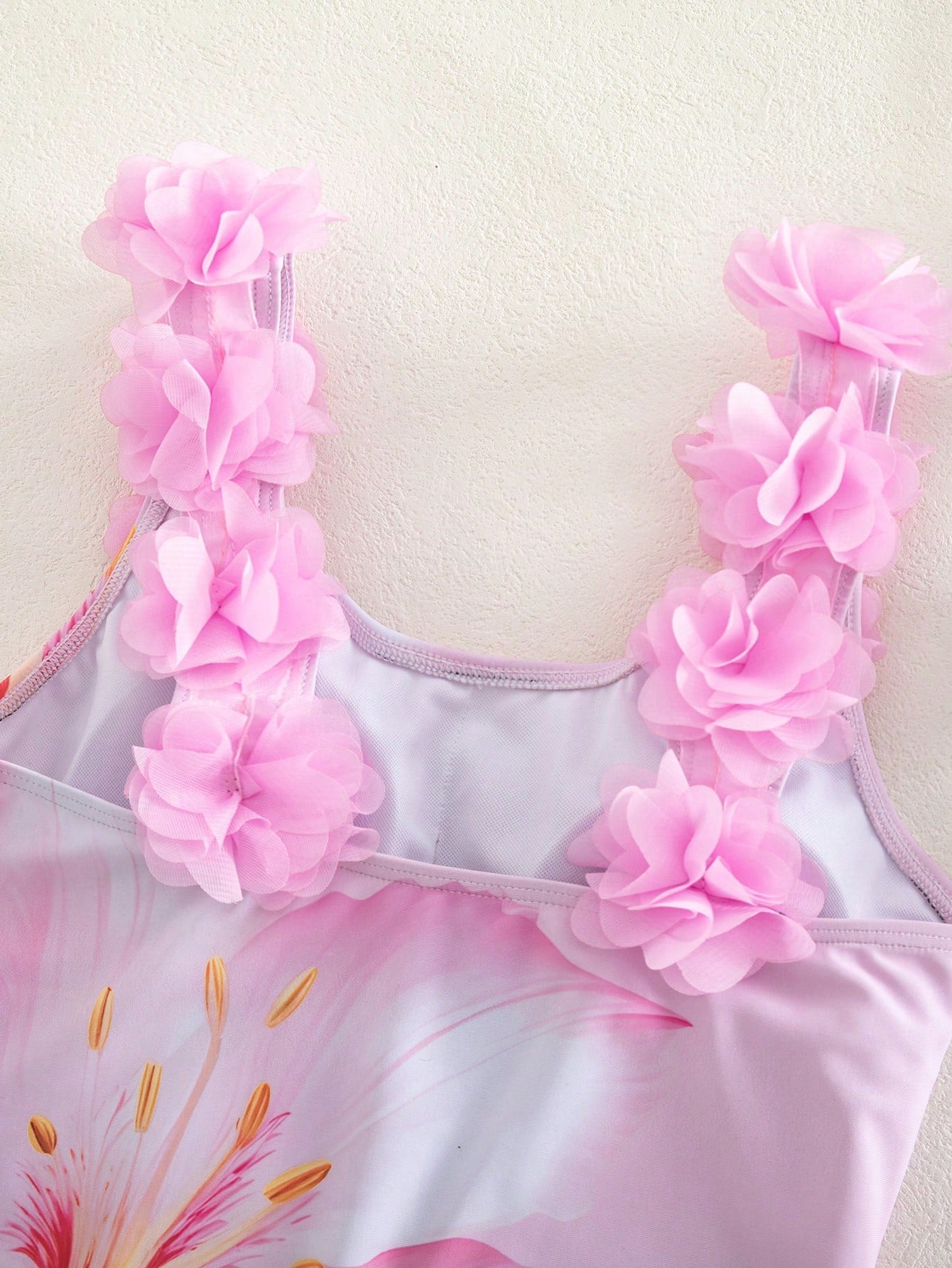 Tween girls one-piece swimsuit with 3D floral applique details, plant graphics, scoop neck, fitted shape, and lined body for beach and vacation wear.