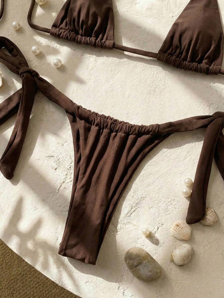Army green high waist micro bikini swimsuit set for women featuring wireless spaghetti strap top with chain knot details and tie side thong bottoms.