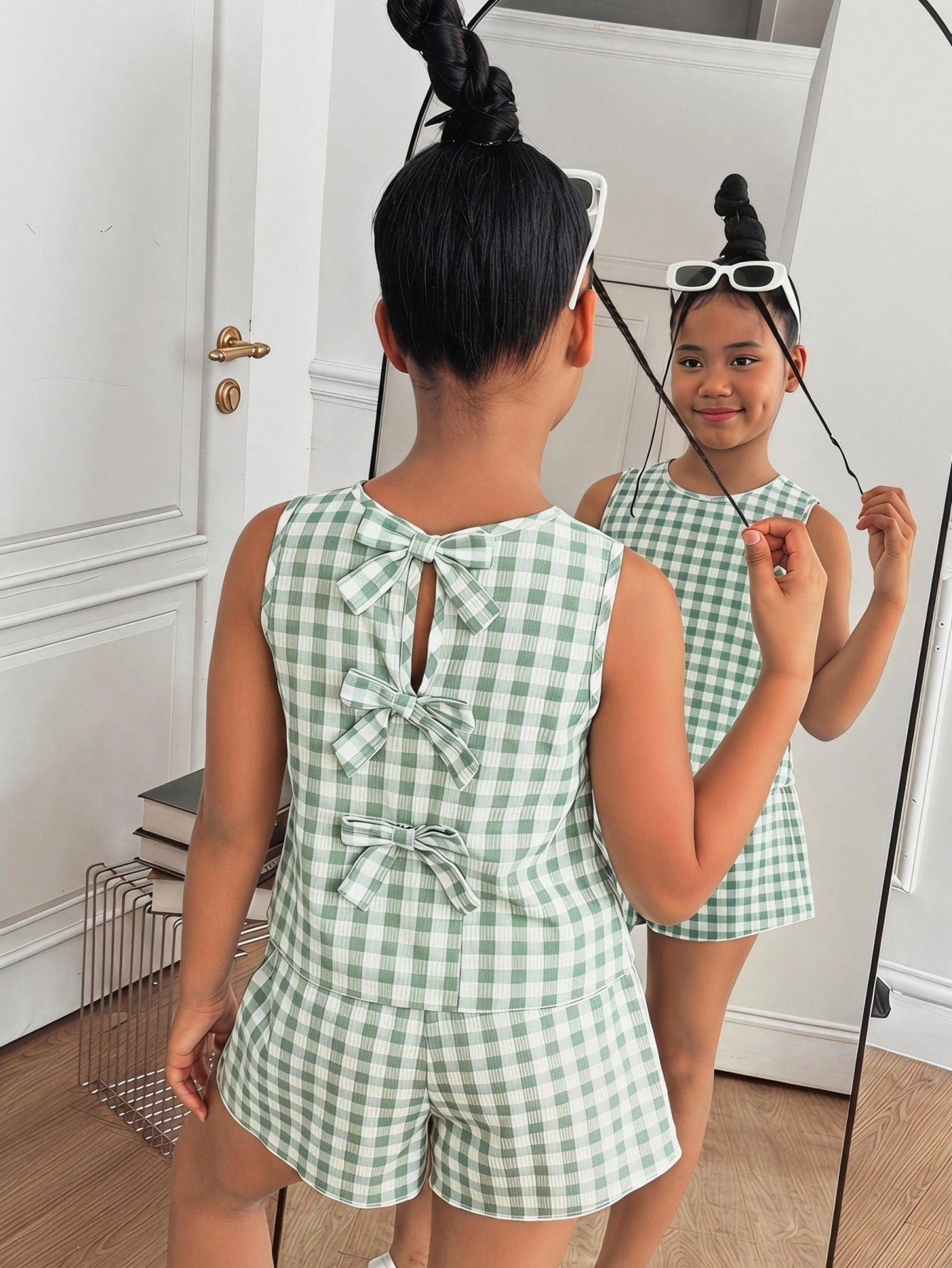 Tween girls casual blue tank top featuring round neck, textured fabric, and bow detail paired with matching shorts set.