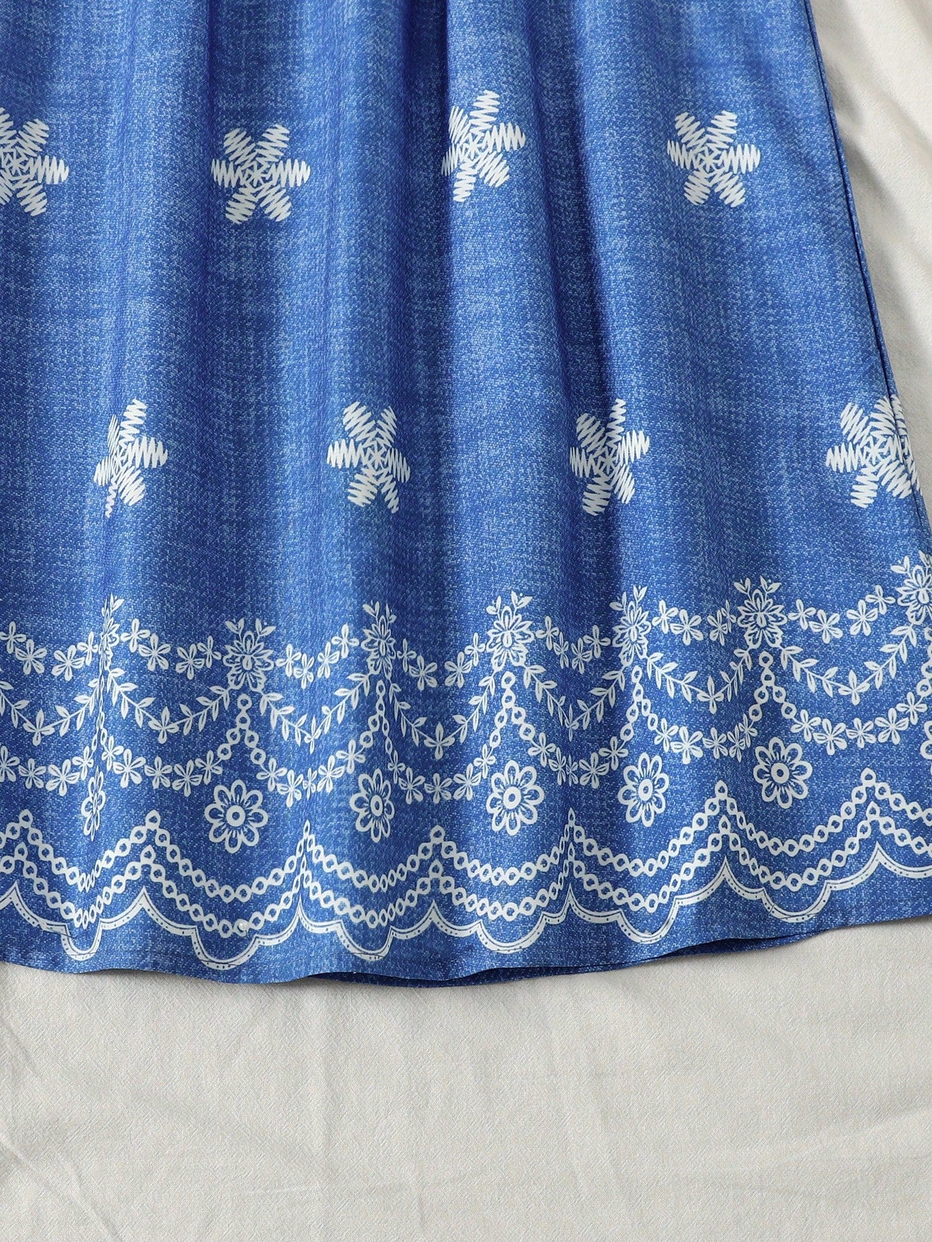 Tween girls floral print dress with halter neckline, sleeveless cold shoulder design, A-line shape, and vacation style.