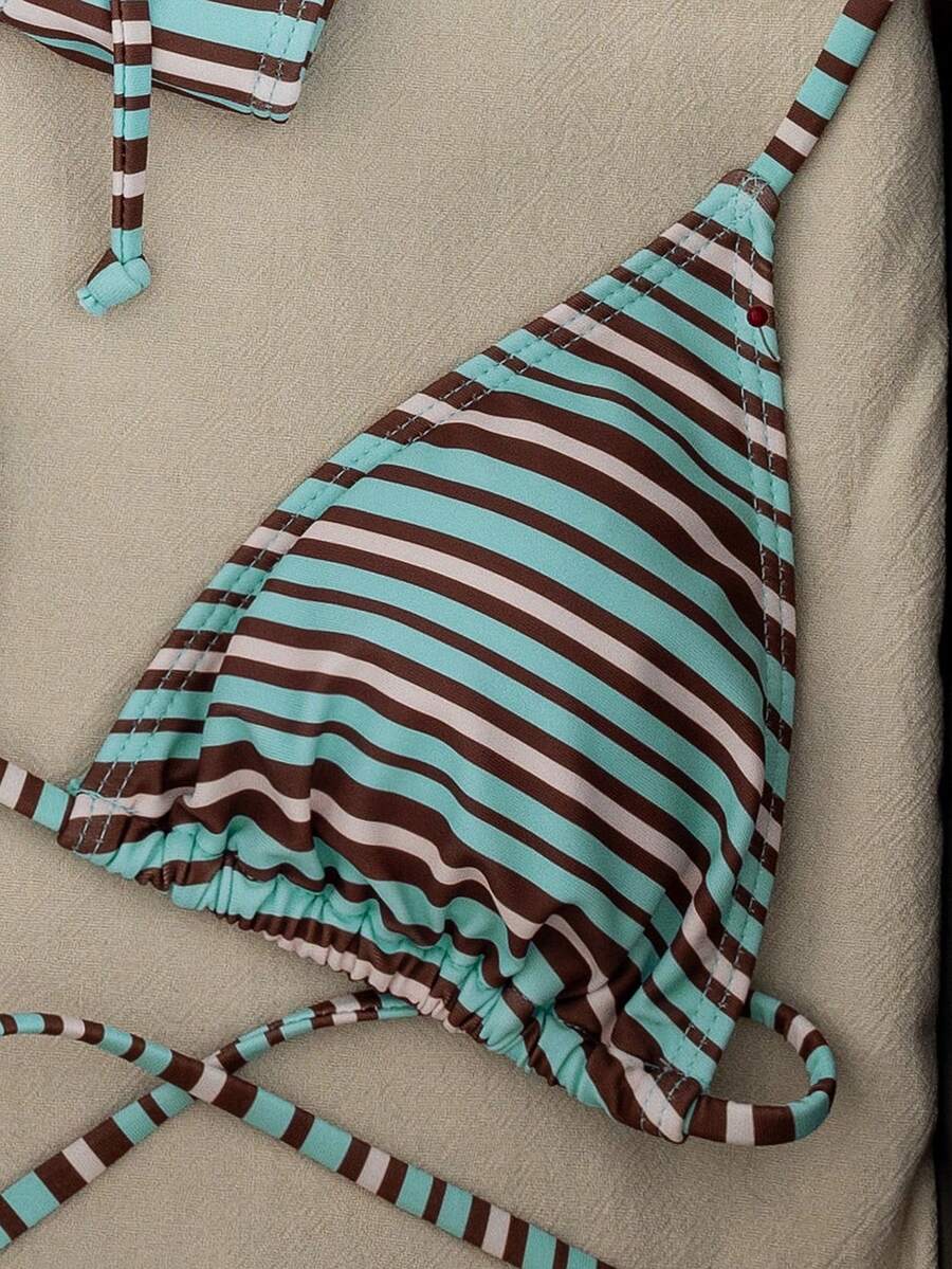 Women's striped halter two-piece swimsuit featuring a lace-up triangle top with removable padding and high-cut low-waist bikini bottoms.
