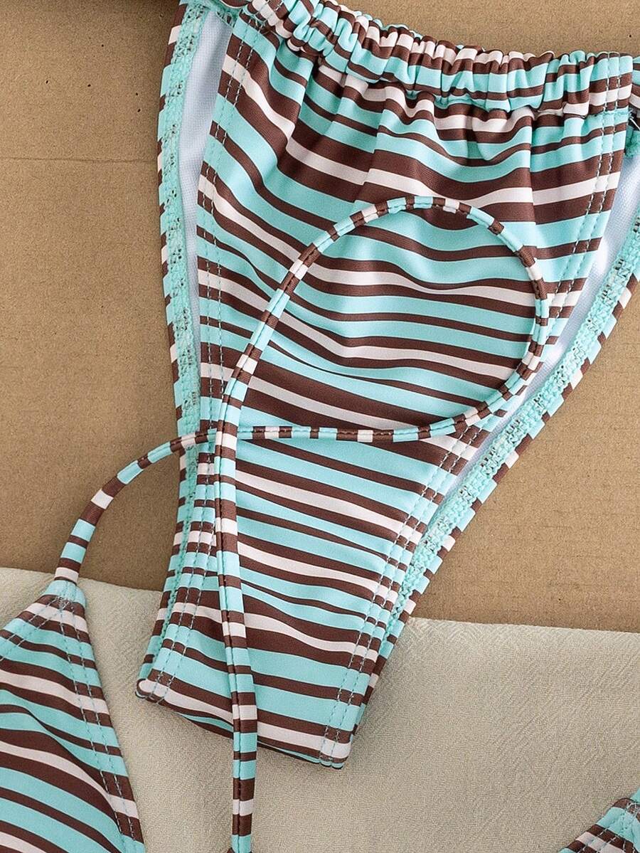 Women's striped halter two-piece swimsuit featuring a lace-up triangle top with removable padding and high-cut low-waist bikini bottoms.