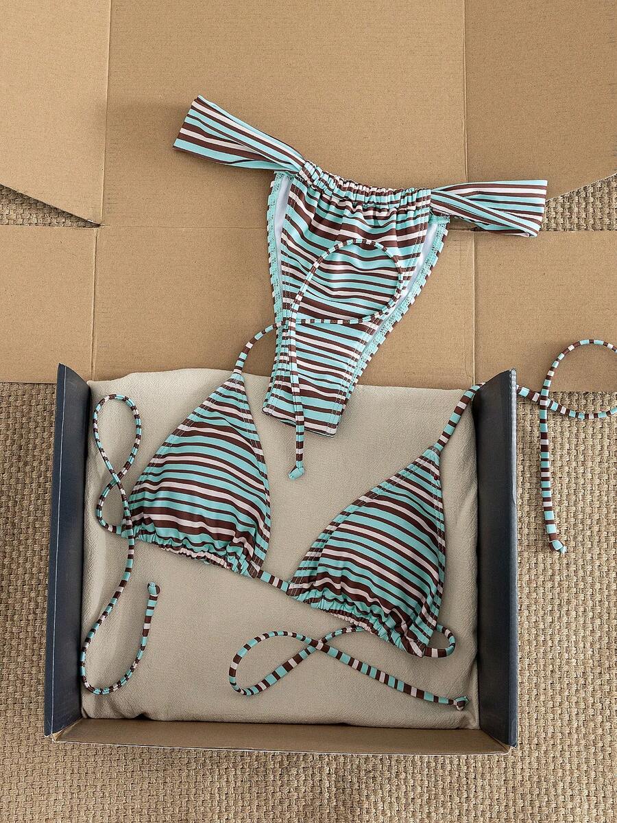 Women's striped halter two-piece swimsuit featuring a lace-up triangle top with removable padding and high-cut low-waist bikini bottoms.