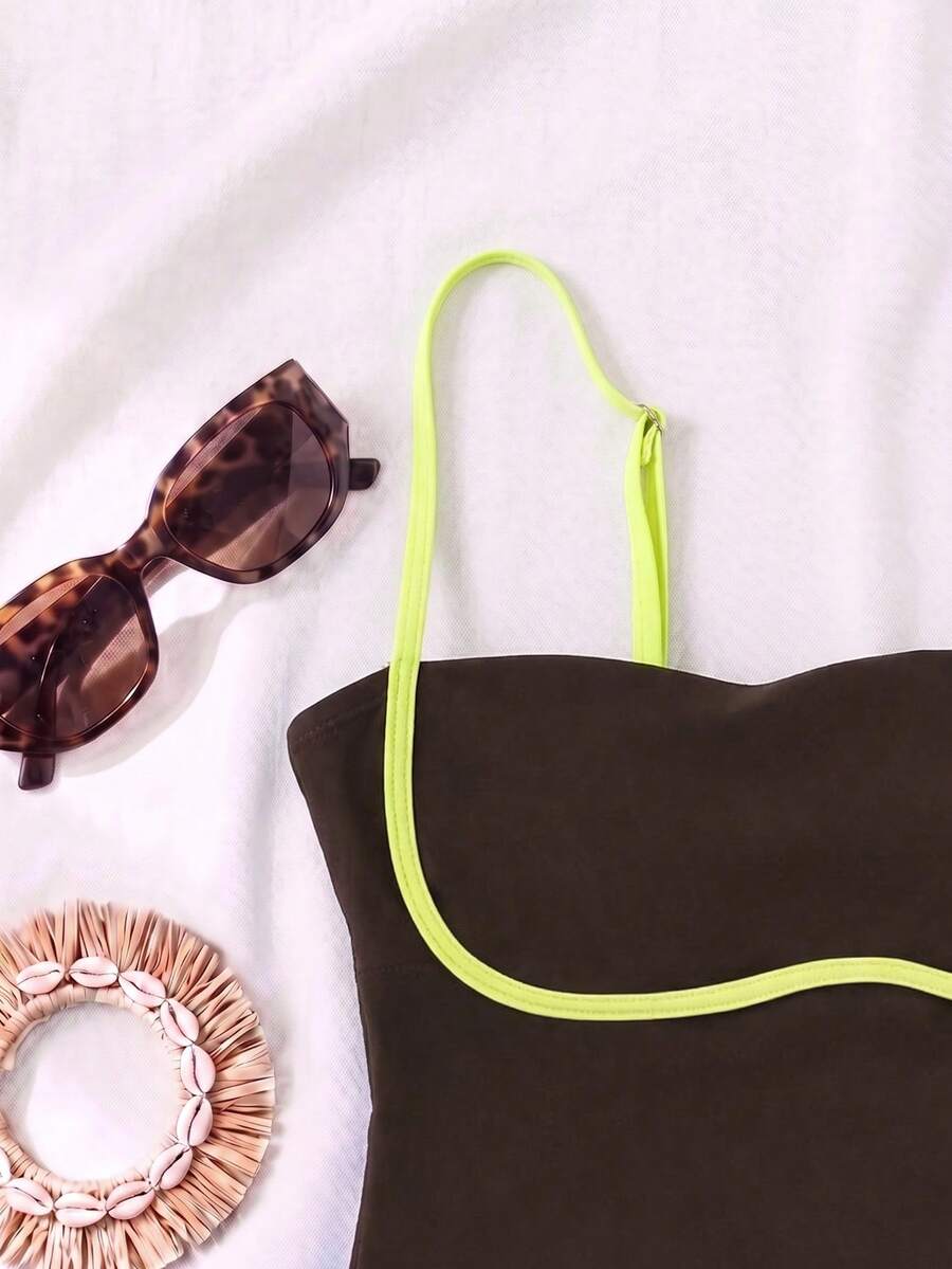 Black colorblock women's one-piece swimsuit with spaghetti straps and high stretch fabric.