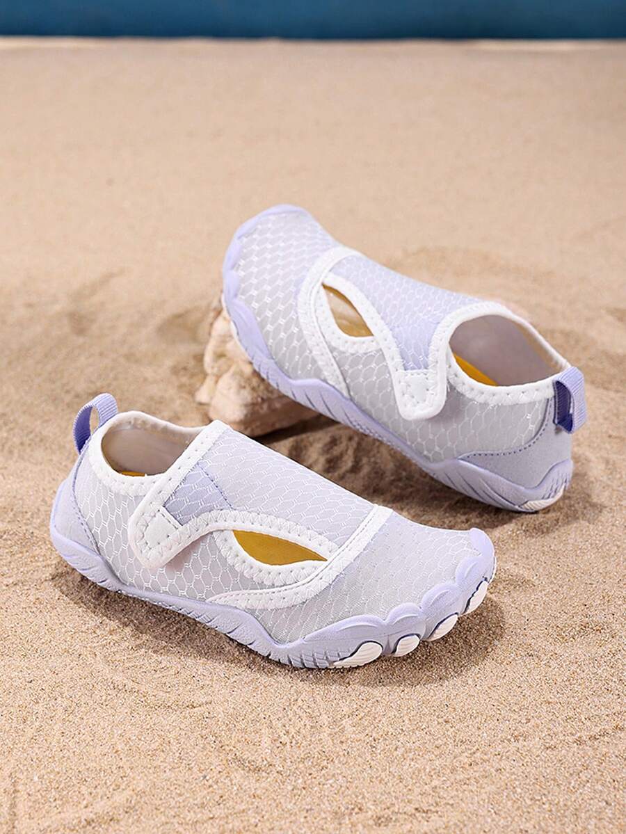 Mauve purple girls water shoes featuring a fabric upper, cut-out colorblock pattern, hook and loop strap, and non-slip rubber sole for outdoor wading.