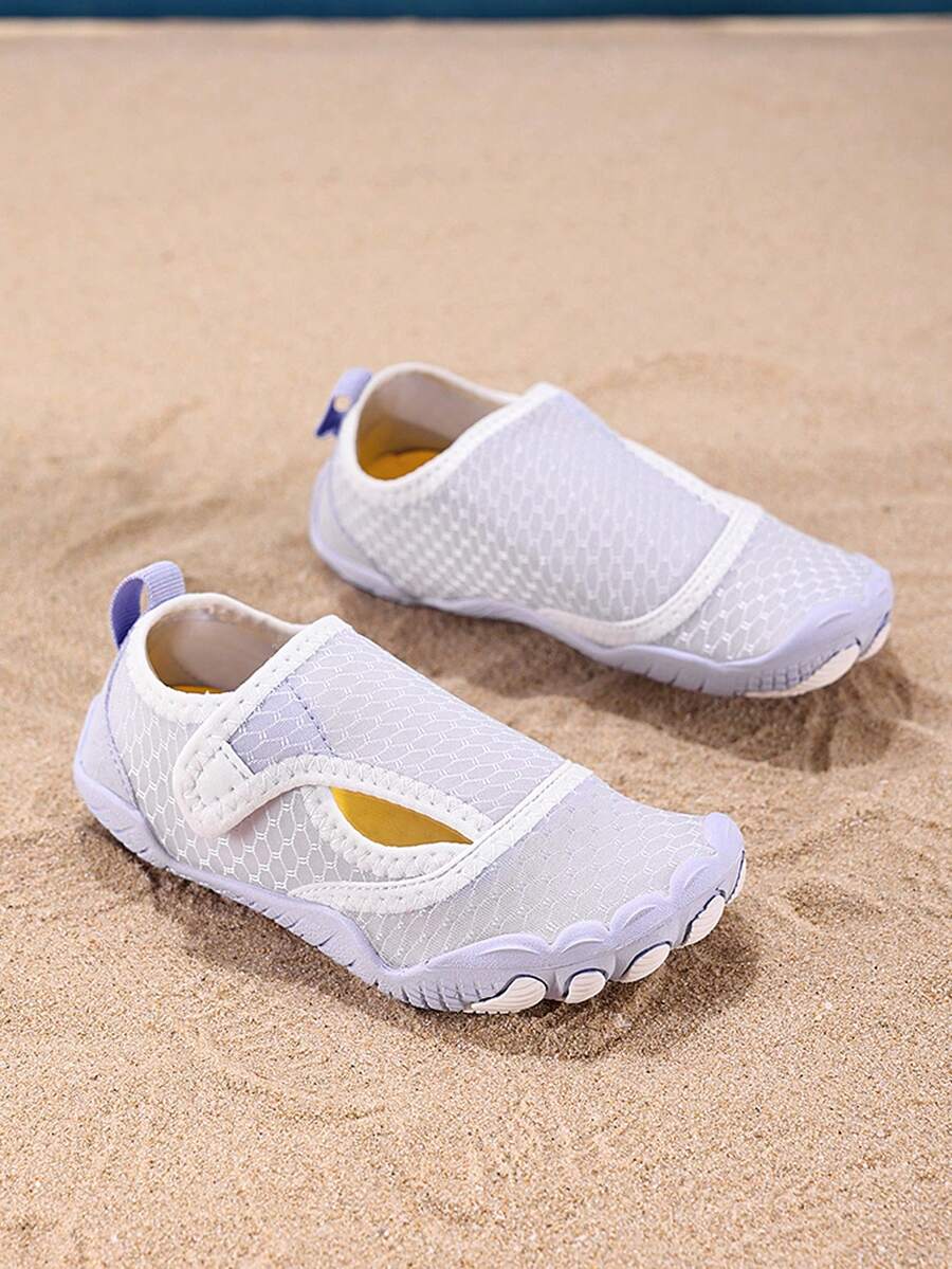 Mauve purple girls water shoes featuring a fabric upper, cut-out colorblock pattern, hook and loop strap, and non-slip rubber sole for outdoor wading.