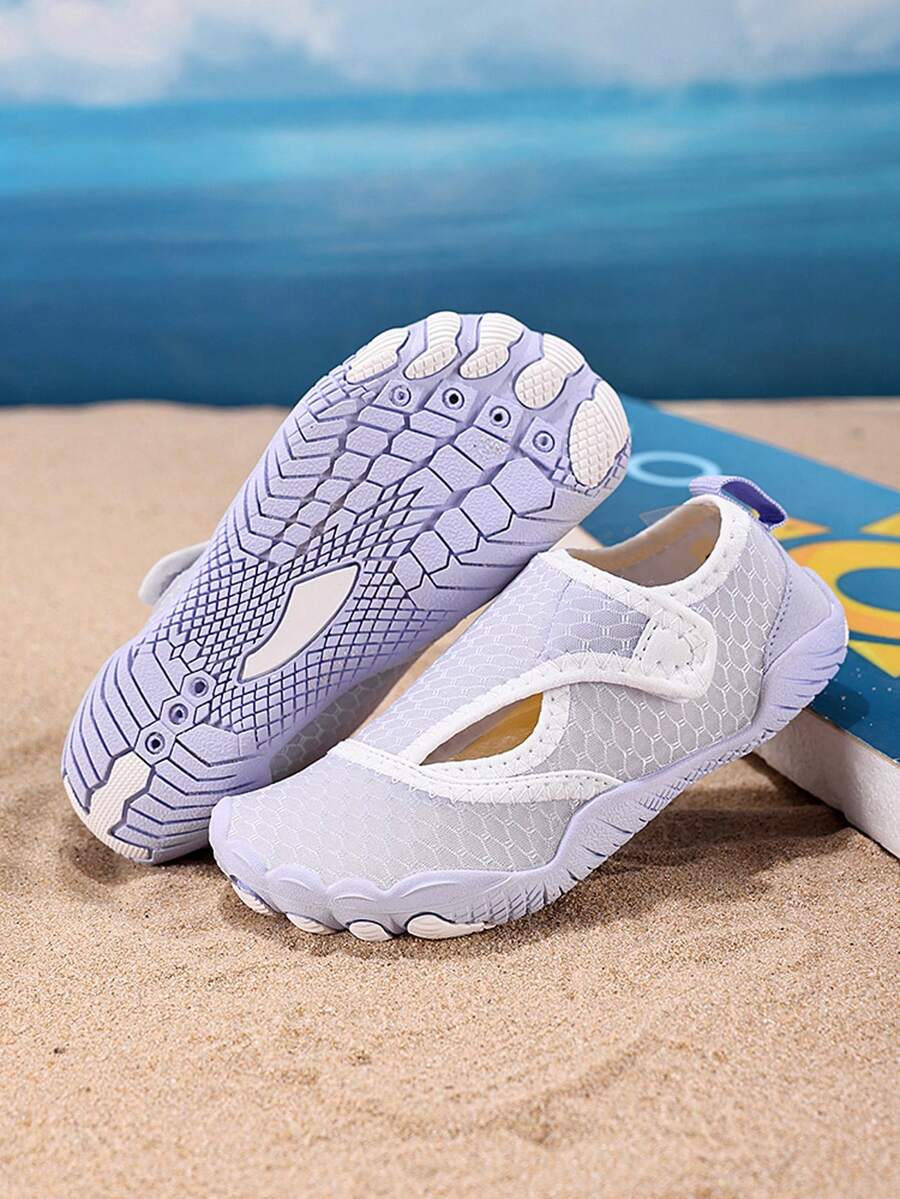 Mauve purple girls water shoes featuring a fabric upper, cut-out colorblock pattern, hook and loop strap, and non-slip rubber sole for outdoor wading.