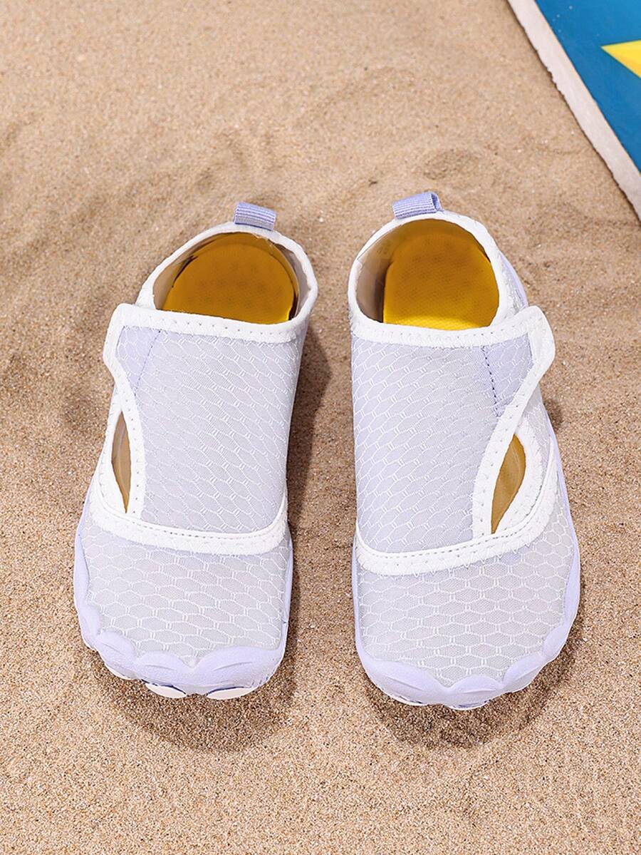 Mauve purple girls water shoes featuring a fabric upper, cut-out colorblock pattern, hook and loop strap, and non-slip rubber sole for outdoor wading.
