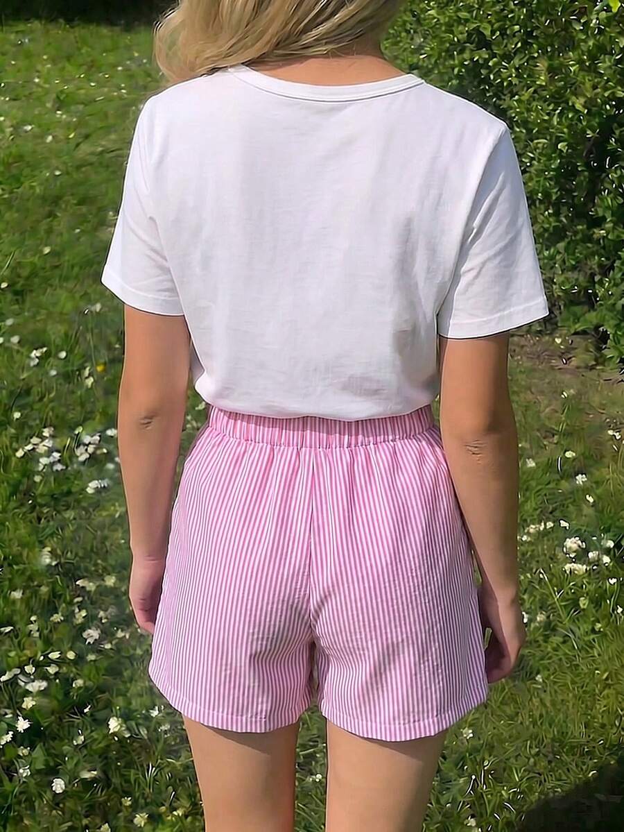 Tween girls 2-piece blue outfit featuring a short sleeve round neck t-shirt with a bow front detail and an asymmetric wrap skort.