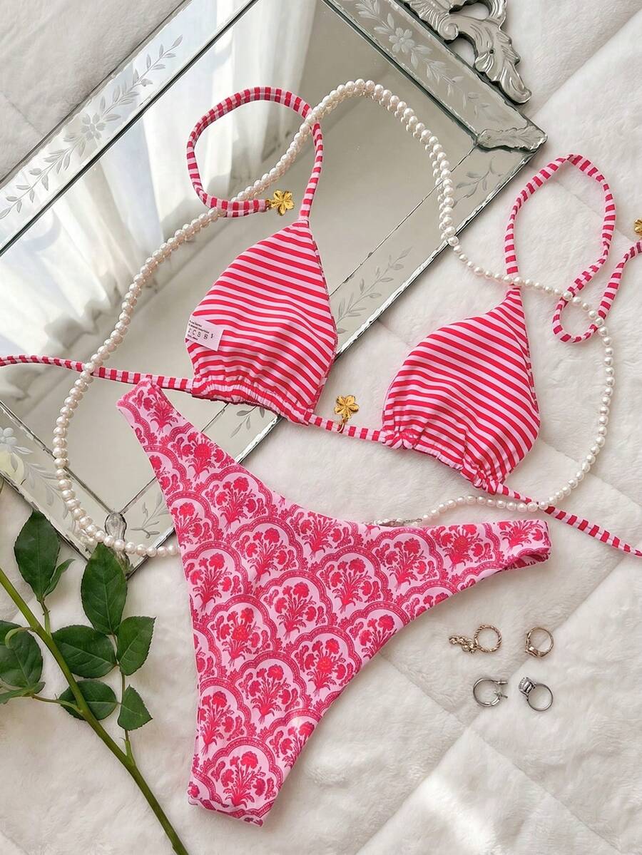 Women's two-piece halter bikini set featuring high cut thong bottoms and removable padding