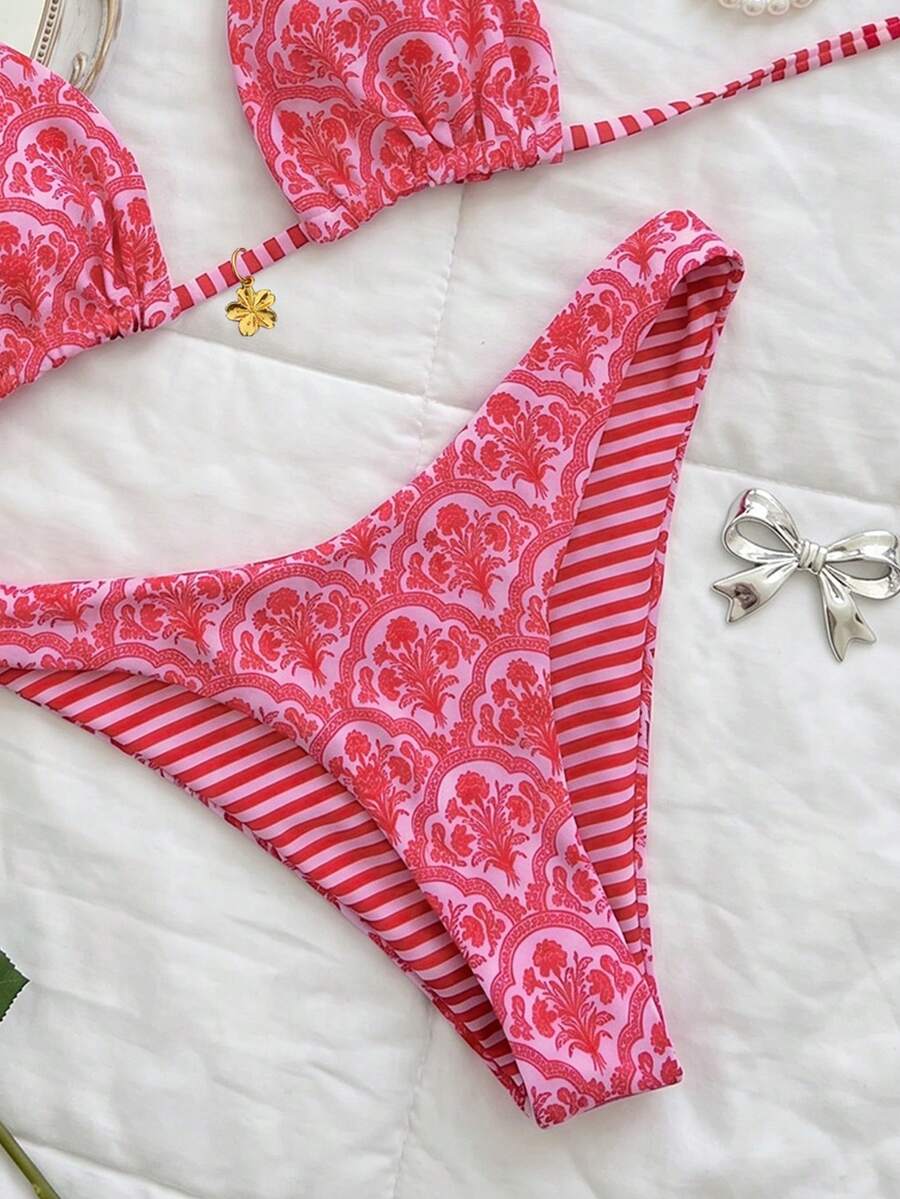 Women's two-piece halter bikini set featuring high cut thong bottoms and removable padding