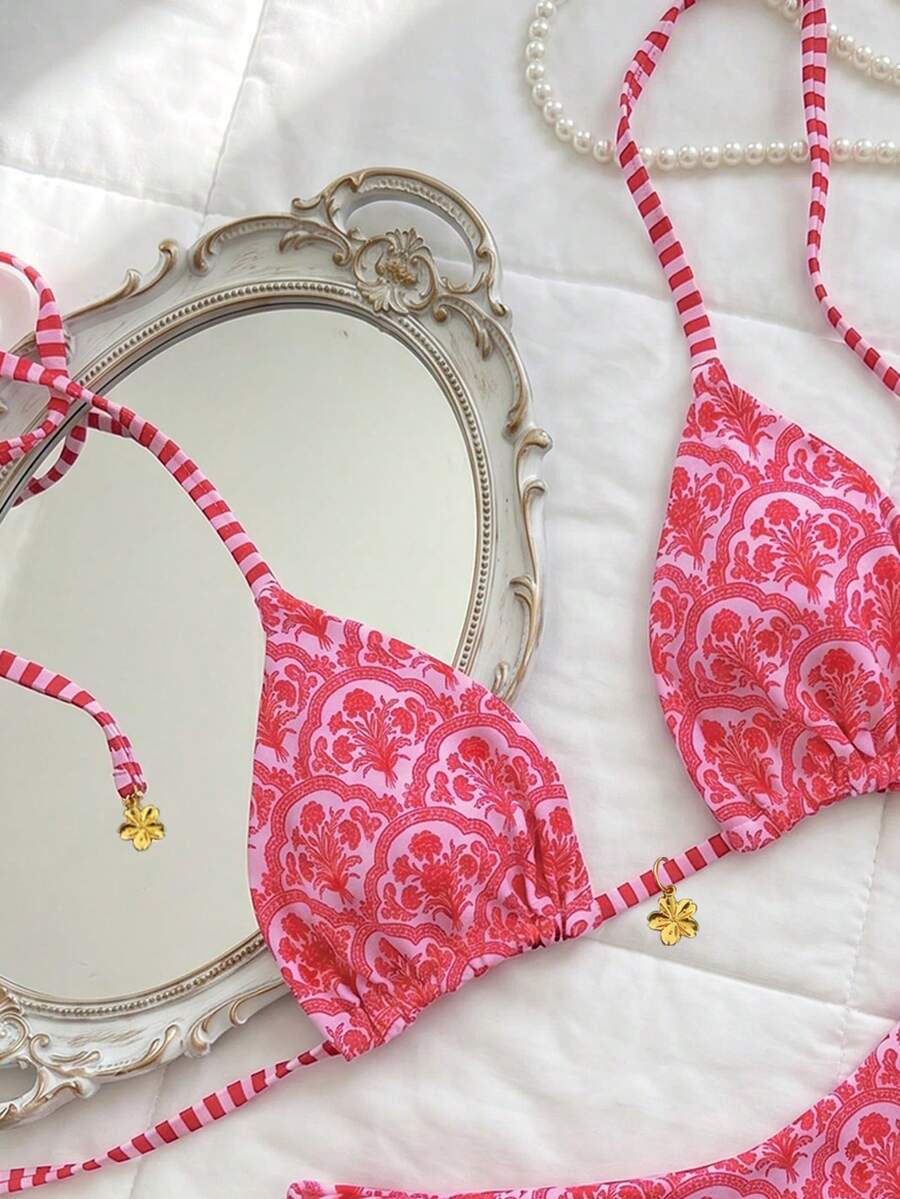 Women's two-piece halter bikini set featuring high cut thong bottoms and removable padding