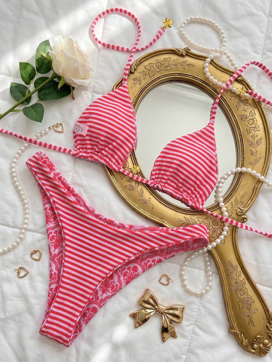 Women's two-piece halter bikini set featuring high cut thong bottoms and removable padding