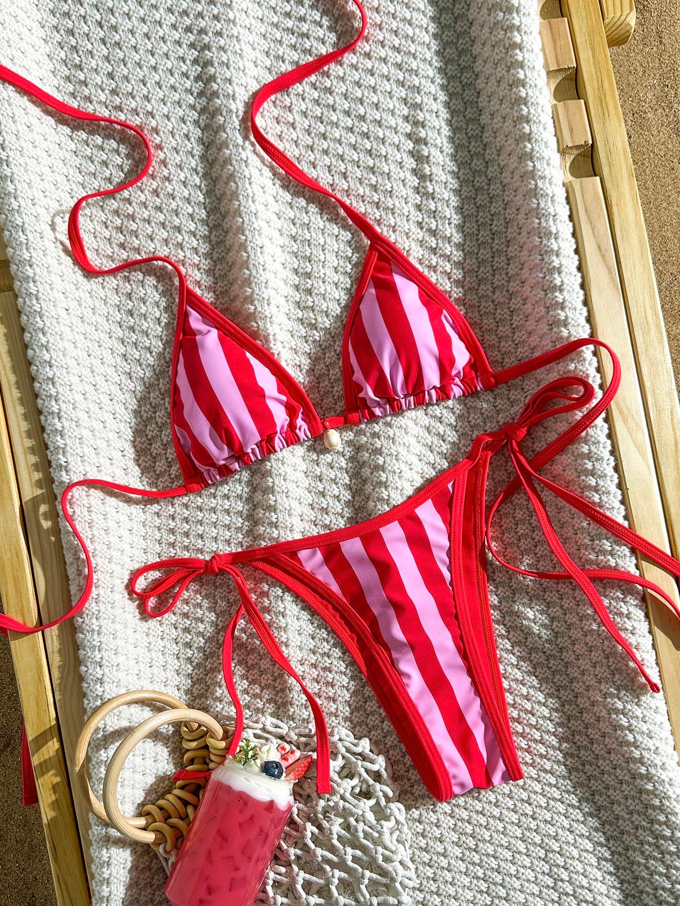 Apricot 2-piece bikini swimwear set featuring a textured halter triangle cup top with knot details and matching tie-side bottoms for women.