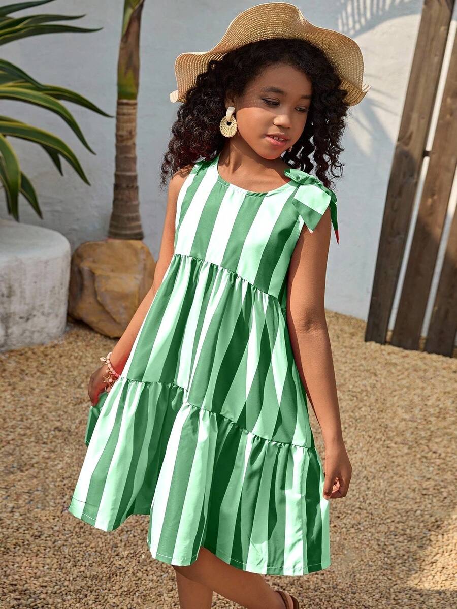 Tween girls blue striped sleeveless smock dress featuring a round neckline, high waist, and flounce ruffle hem.
