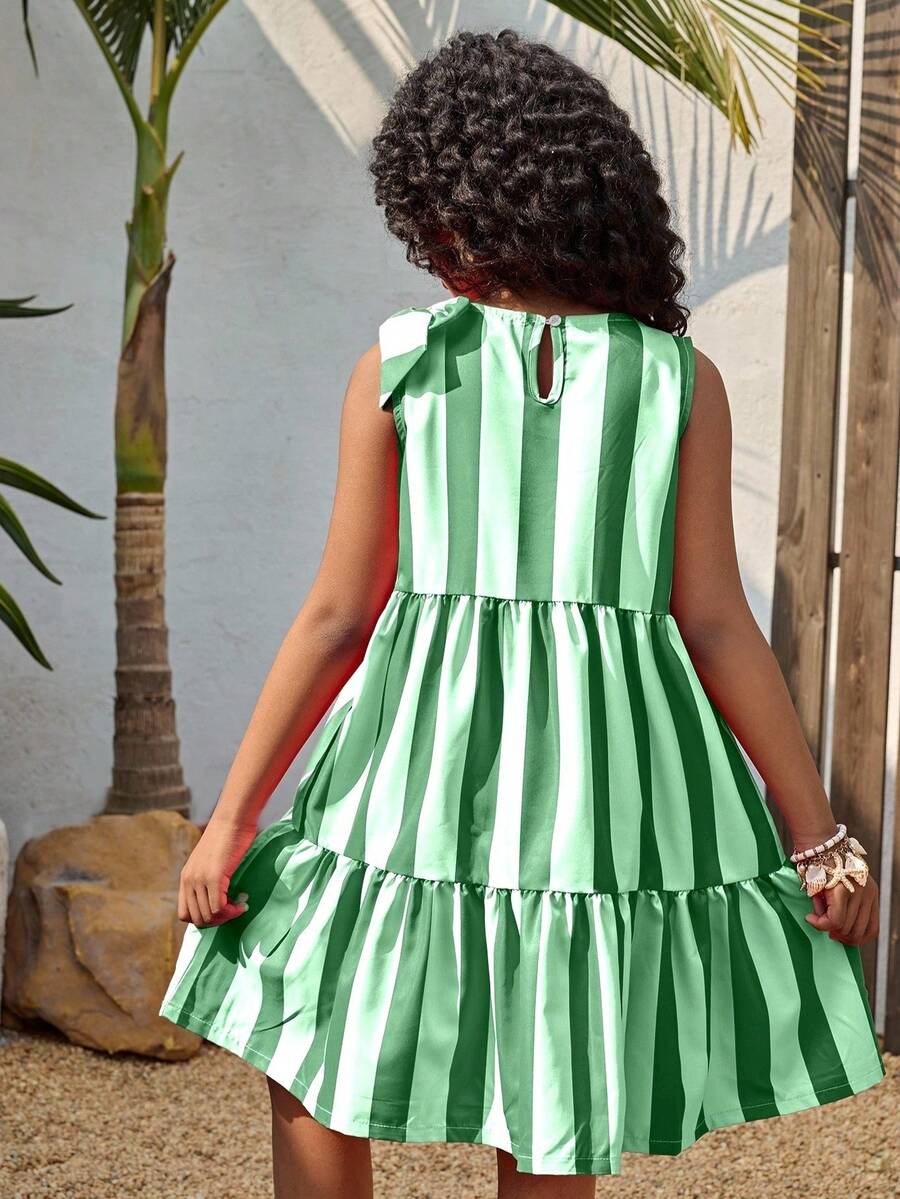 Tween girls blue striped sleeveless smock dress featuring a round neckline, high waist, and flounce ruffle hem.