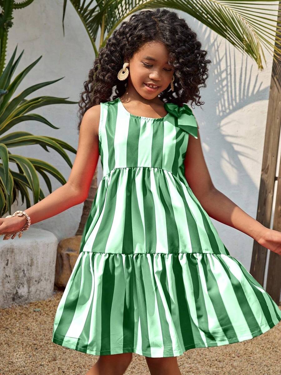 Tween girls blue striped sleeveless smock dress featuring a round neckline, high waist, and flounce ruffle hem.