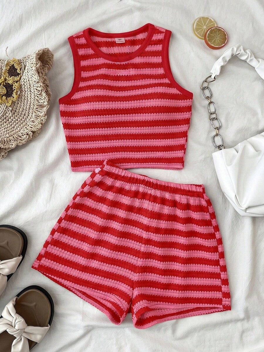 Tween girls black and white two-piece casual summer outfit featuring a rib-knit cropped top with round neck and matching shorts with contrast piping.