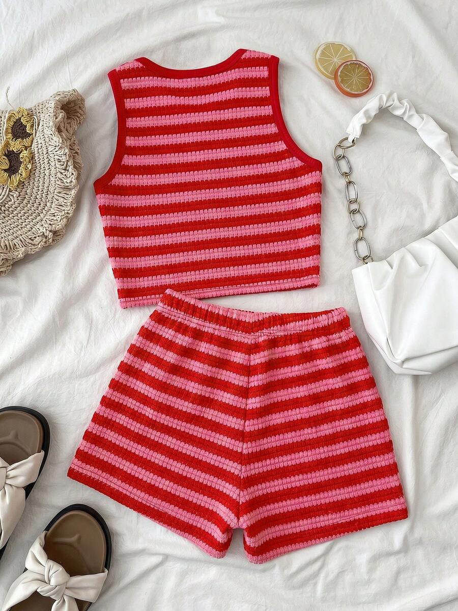 Tween girls black and white two-piece casual summer outfit featuring a rib-knit cropped top with round neck and matching shorts with contrast piping.