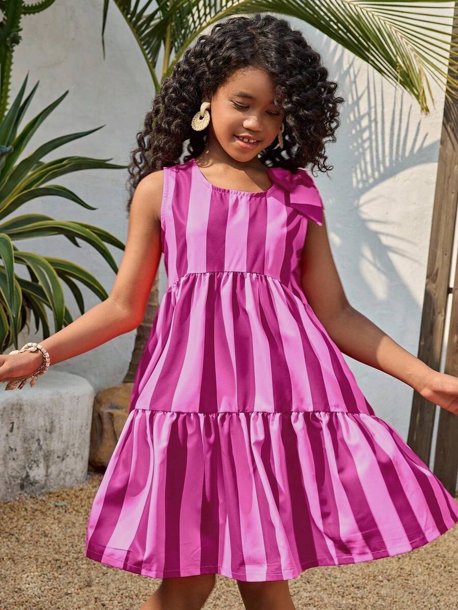 Tween girls blue striped sleeveless smock dress featuring a round neckline, high waist, and flounce ruffle hem.