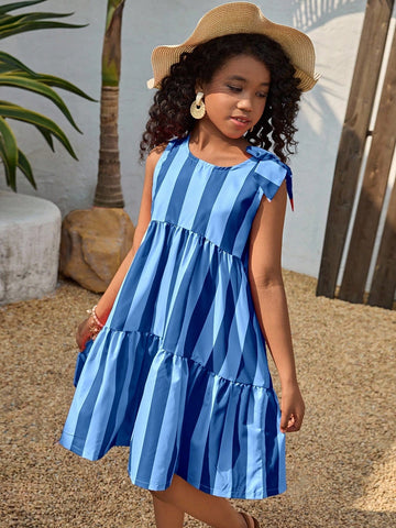 Tween girls blue striped sleeveless smock dress featuring a round neckline, high waist, and flounce ruffle hem.