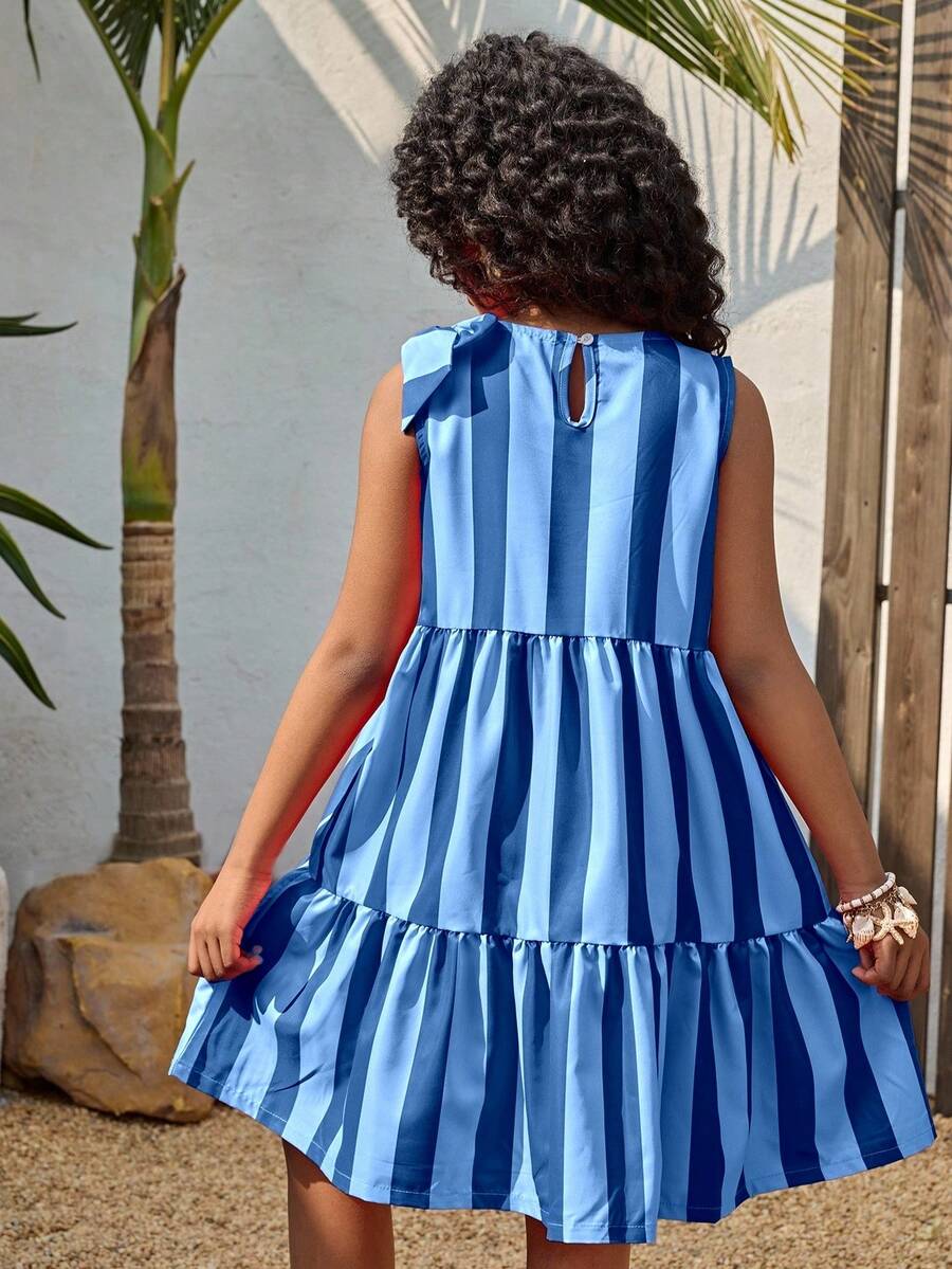Tween girls blue striped sleeveless smock dress featuring a round neckline, high waist, and flounce ruffle hem.