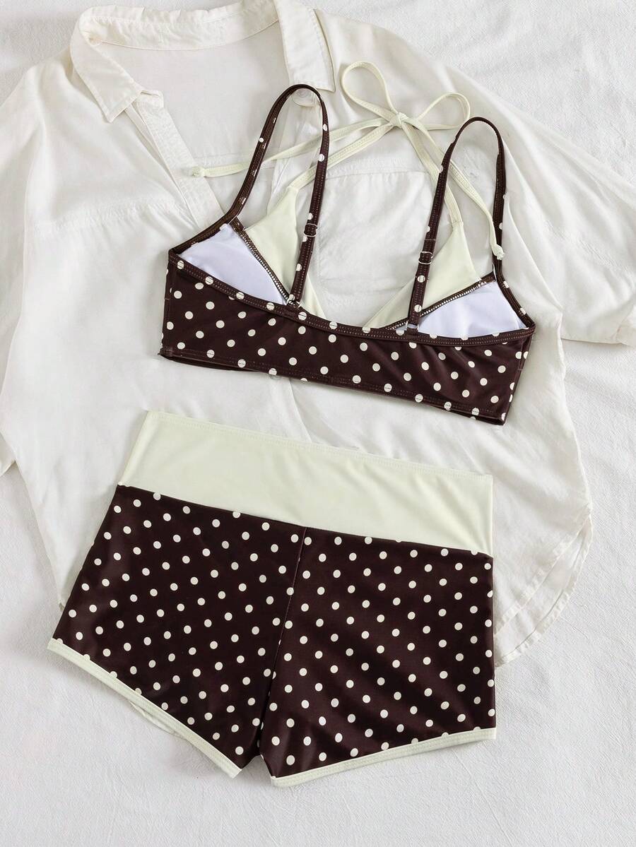 Women's retro pink and blue cartoon sardine print halter two-piece swimwear featuring a high waist shorts bottom and wireless bra with removable padding.