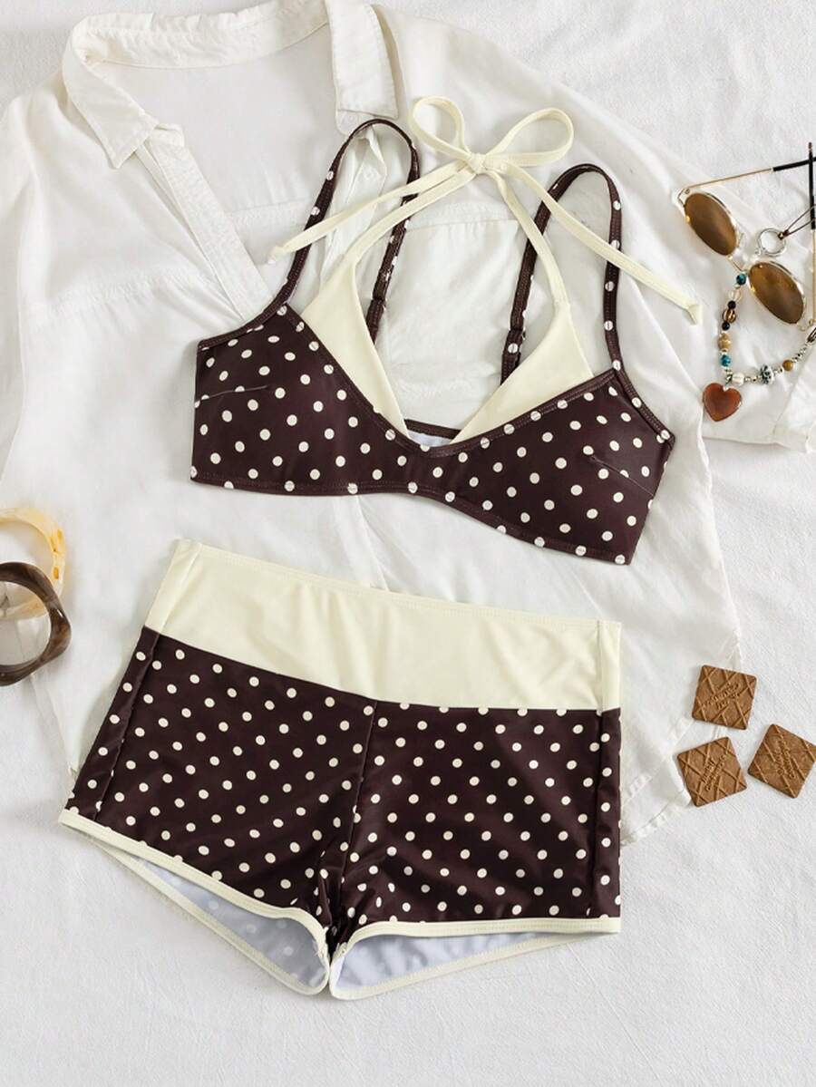 Women's retro pink and blue cartoon sardine print halter two-piece swimwear featuring a high waist shorts bottom and wireless bra with removable padding.