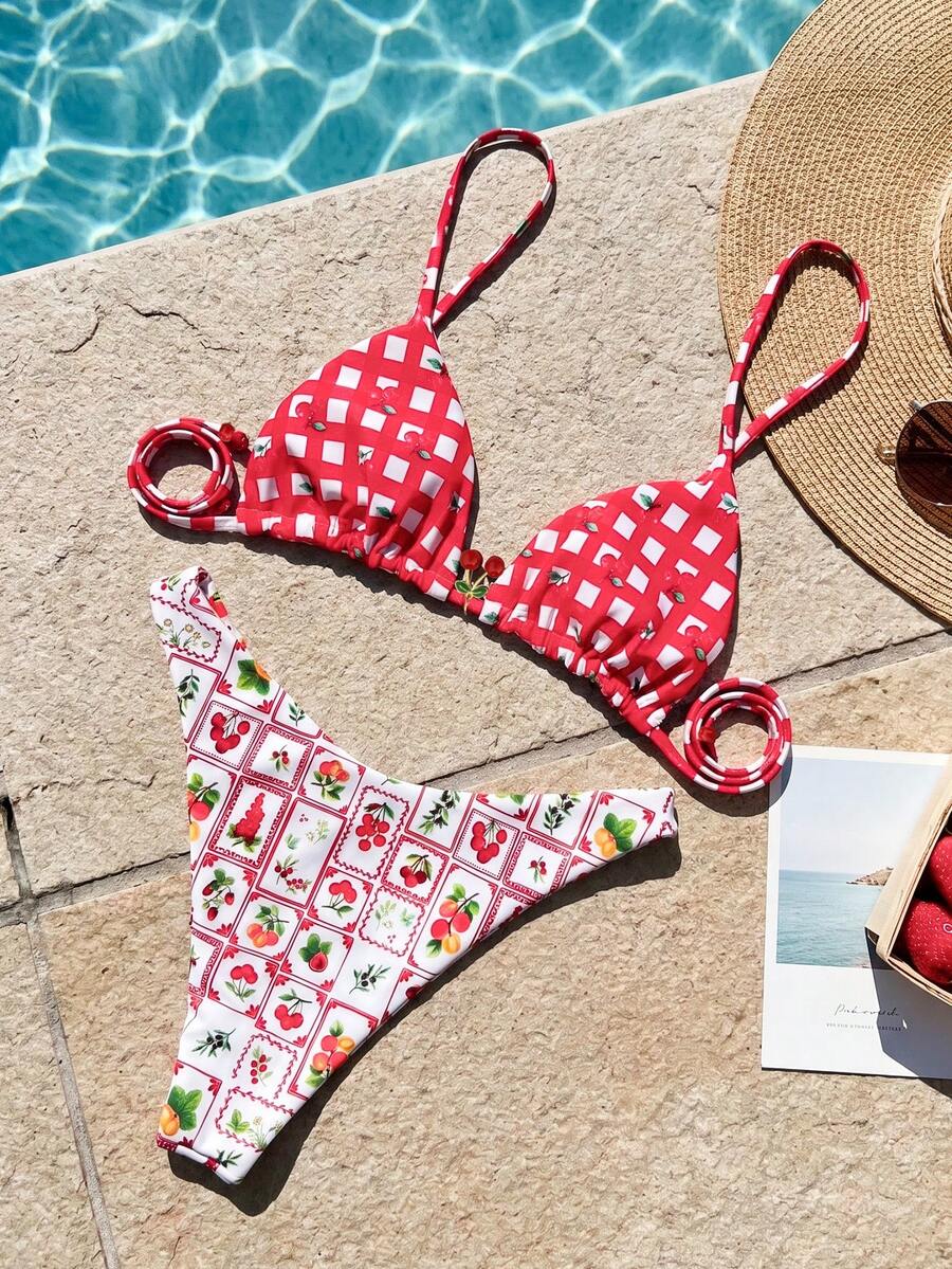 Women's two-piece halter bikini set featuring high cut thong bottoms and removable padding