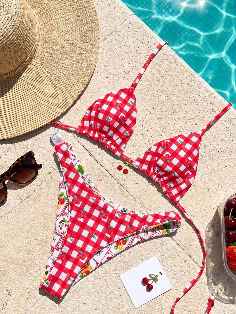 Women's two-piece halter bikini set featuring high cut thong bottoms and removable padding