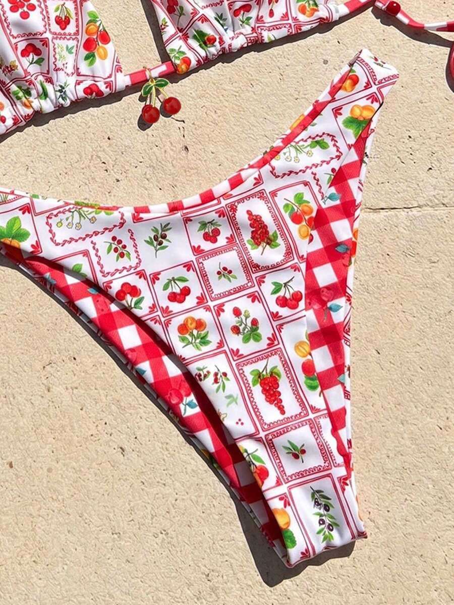 Women's two-piece halter bikini set featuring high cut thong bottoms and removable padding