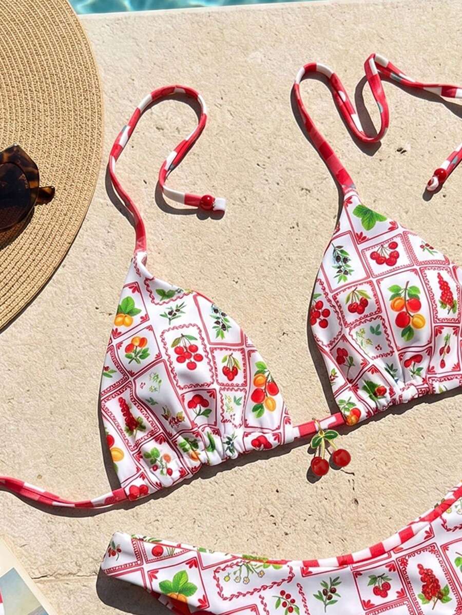 Women's two-piece halter bikini set featuring high cut thong bottoms and removable padding