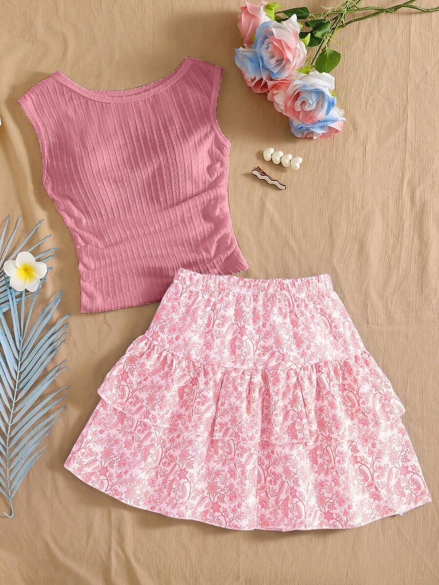 Light blue two-piece outfit set for tween girls with a sleeveless round neck vest top and a tiered ruffle cake skirt featuring a plant pattern.
